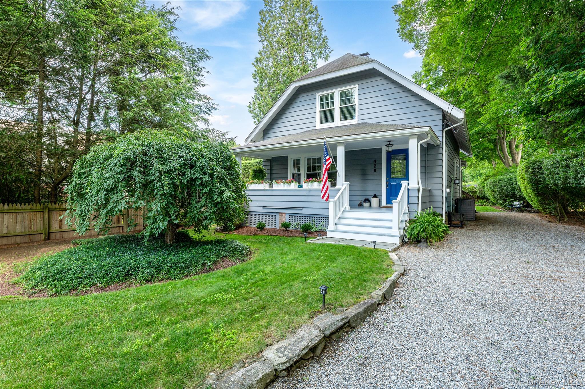 In the heart of Bedford Village, this storybook 1925 Cape blends timeless character with thoughtful updates. A gracious covered front porch sets the tone, welcoming you into a home rich with period details, solid wood flooring, oversized windows in every room and a warm inviting scale.The cozy living room is anchored by a classic fireplace. The updated kitchen features solid wood custom cabinetry, & chef's appliances. With easy access to the formal dining room or the rear deck, ideal for outdoor dining while overlooking a flat yard framed by established landscaping.With three bedrooms and two full baths, the layout offers flexibility, including a first floor bedroom that adapts as needed. Upstairs, a primary suite with vaulted ceiling & skylight brings in soft natural light throughout the day. Charming and a little unexpected.Set just moments from the village green, Bedford Village Memorial Park, local shops, convenient to trains, and major highways, this is an effortless Bedford lifestyle offering. A spacious basement provides excellent additional storage. Impeccably maintained and truly move-in-ready. This home has been one of those adorable houses people slow down to notice.