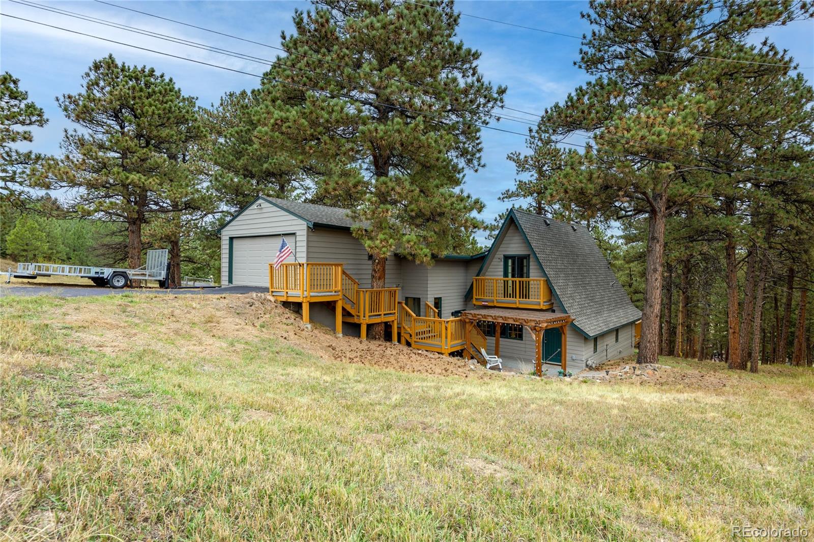 Mountain style gem 2 story home, in Lookout Mountain area for under $900k. Panorama Heights. 3 bedrooms plus 2 full bathrooms and an additional upper level bonus multi-purpose room; 396 SF. This home sits on a 30,000 SF lot. HVAC is Bryant Commercial grade high efficiency is new spring of 2026. Main level features wood floors, a great room with a fireplace that has a blower all engulfed in a stone hearth, 2 full bathrooms, formal dining room off kitchen area, and the kitchen features granite counters, all appliances included, large kitchen pantry and direct backyard deck access, a washer/dryer stackable is also included. Primary Bedroom can be found on the main level as well, with barn doors for entry and primary closet access, the walk-in closet features custom closet shelving, and the shared primary JJ full bath with a tub/shower combo, stylish wood vanity and beautiful tile surround and tile floors. The upper level features 2 bedrooms with wood floors and custom closet shelving and one bedroom has a private balcony access attached. The home is listed at 4 bedrooms including the finished upper level bonus room currently set up as a bedroom with 2 closets. Front yard pergola with lights is perfect for morning coffee. Well and Septic. Roof is approx. 10 yrs old. Updated electrical panel. Geowater Filtration sediment system. Setup for power outage generator. Pella crank encasement windows. Backyard is lined with tree's gorgeous setting. Storage areas are professionally designed for max usage. This home has so much to offer!