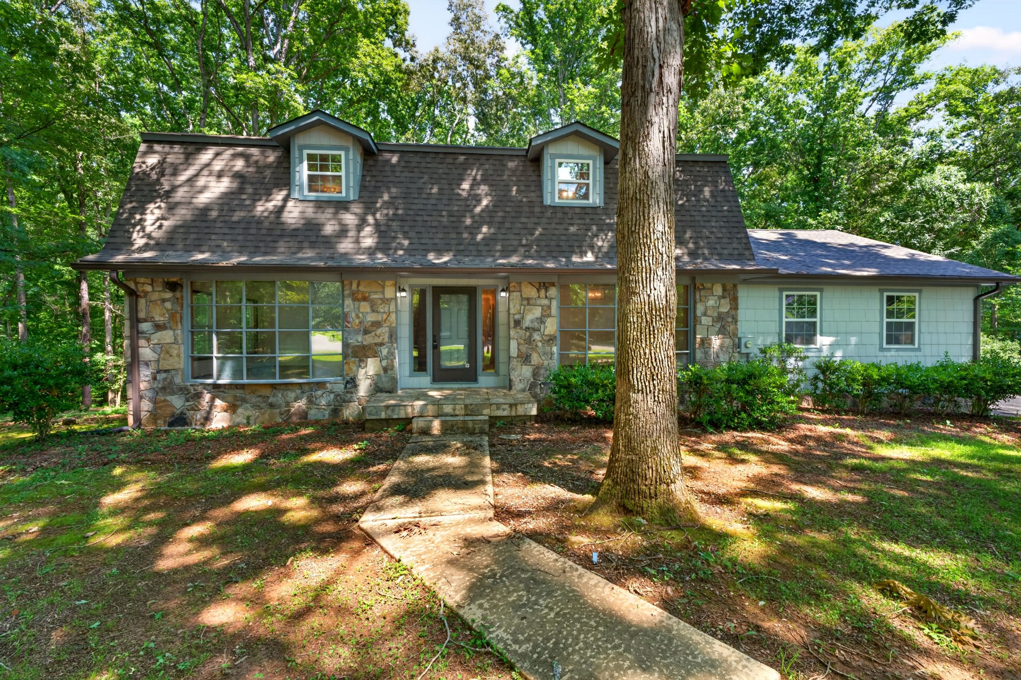 Welcome home to the perfect blend of space, comfort, and convenience!! Nestled on 2.21 beautiful acres at the end of a cul-de-sac just minutes from Tims Ford Lake, shopping/dining, this impressive 4,244 sq ft home offers room for everyone inside and out. Boasting 5 spacious bedrooms, 2 full bathrooms, and 2 half baths, this home is designed for both everyday living and entertaining. The fully finished basement provides endless possibilities for a recreation room, home office, gym, media room, or guest space. You'll appreciate the many recent updates, including a new roof and new windows. Situated outside the city limits, you'll enjoy added privacy and fewer restrictions while being conveniently close to all amenities you need. Natural gas is available at the road. Whether you're looking for space to grow, entertain, or simply enjoy peaceful  country living near the lake, this exceptional property checks all the boxes.