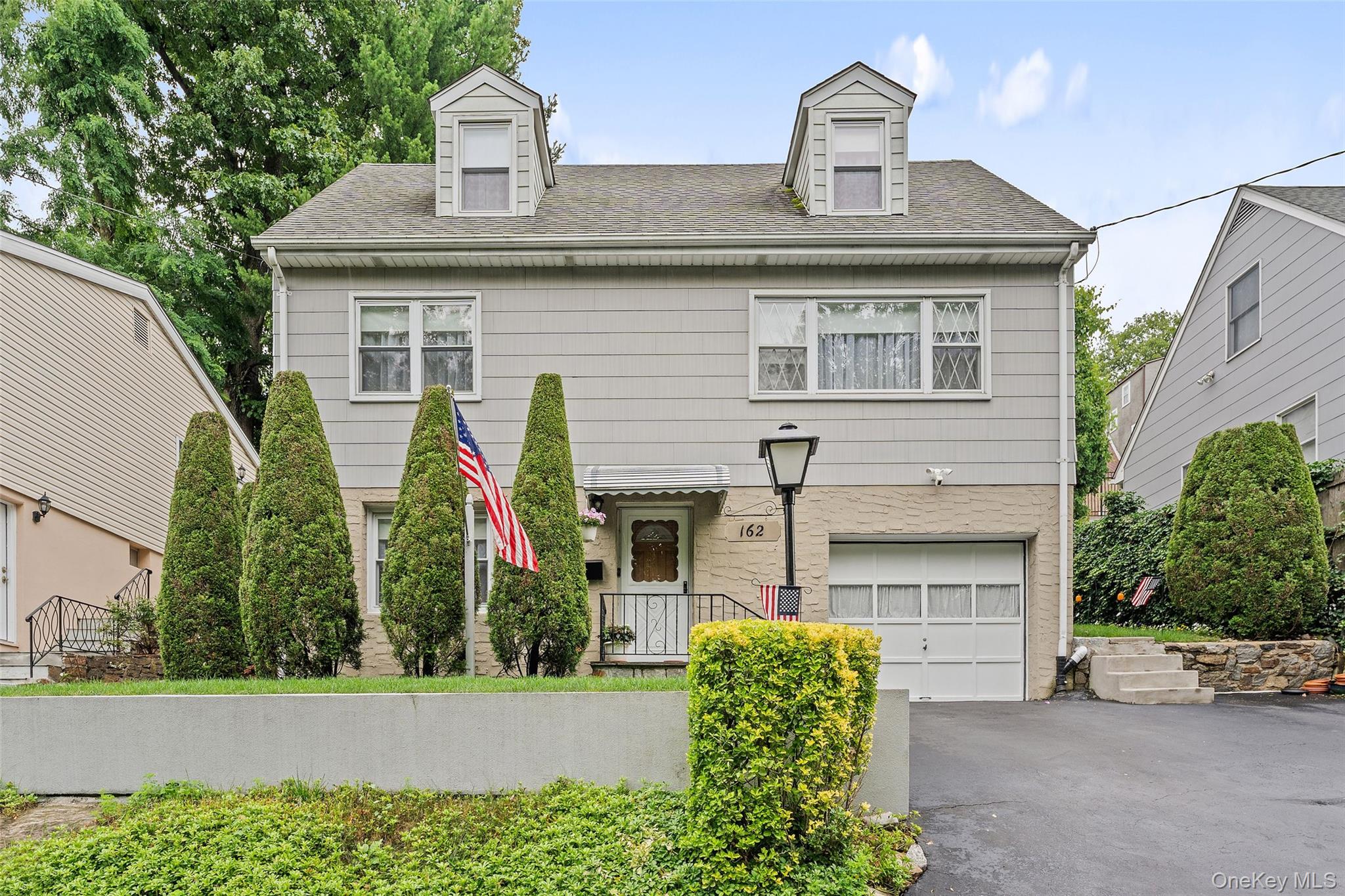This Lincoln Park raised Cape Cod sits directly across from both Westchester County Park and Tibbetts Brook Park, two of the best green spaces in Yonkers. Nature trails, soccer fields, tennis courts, miniature golf and a lazy river pool are all literally outside your front door. No homes facing you, just trees, open space and the kind of quiet that's hard to find this close to New York City. This pristine home has been carefully maintained and it is evident as soon as you enter the residence. Four bedrooms, two full baths, hardwood floors throughout and a finished lower level with tile. Every corner reflects the pride the owners have taken in it over the years. The backyard is beautifully landscaped with great room to entertain. One-car garage with ample storage, plus two driveway parking spaces. Dunwoodie Golf Course is nearby. So are shopping, restaurants and the gym.  For commuters, this location is hard to beat. Express buses, the No. 4 subway and Metro North are all just minutes away. Prefer to drive? The Saw Mill, Sprain Brook and Cross County parkways are all within easy reach.  Homes like this are rare.