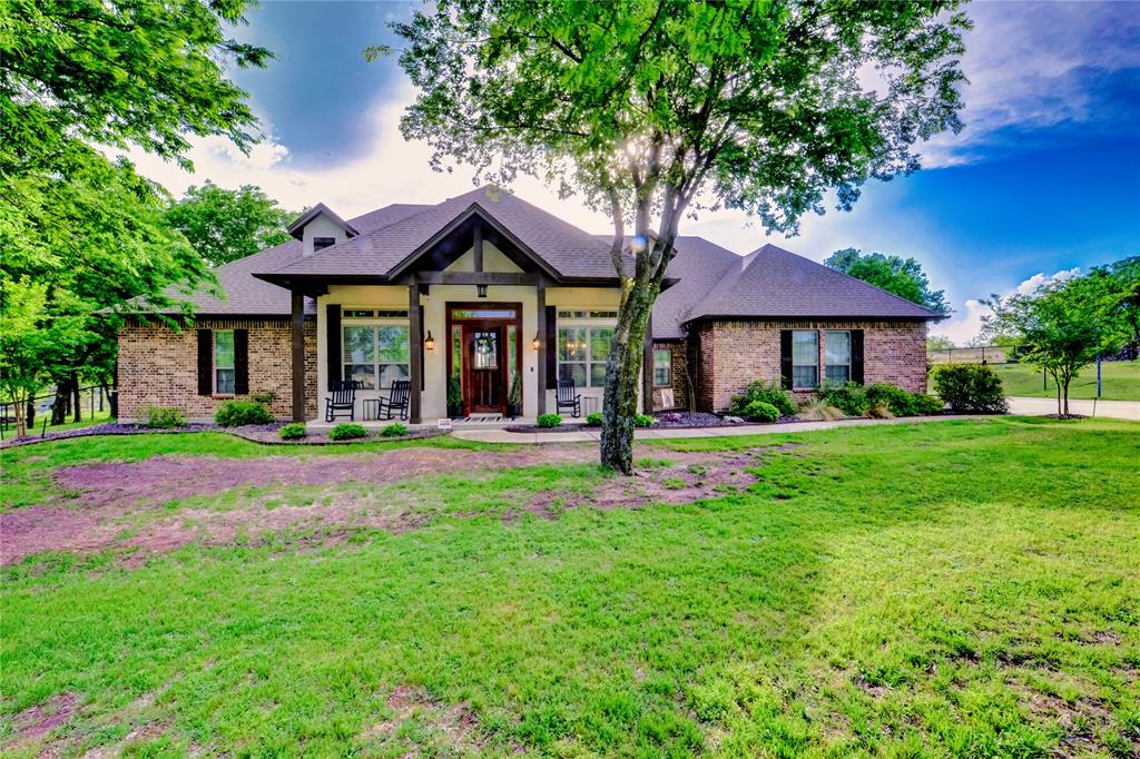 Tucked away on nearly an acre in the highly sought-after Aledo ISD, this custom-built home offers the perfect blend of privacy, space, and functionality. Situated on .964 acres and backing up to a peaceful ranch, you’ll enjoy wide-open views and a serene setting right from your backyard. The thoughtfully designed layout features 3 bedrooms, 2.5 baths, a dedicated office, and a well-appointed laundry room complete with a built-in laundry wall tree for added organization and convenience. Inside, you’ll find granite countertops, custom cabinets and a large walk in pantry. Outside, the property truly shines with a 3-car garage and ample space to add a pool, shop, or both. There is also a built in basketball goal as well as electricity and sewer hookup for a 50 amp RV.  Evenings are best spent gathered around the outdoor firepit area or on the back patio watching the sunset, making this home as inviting for entertaining as it is for everyday living.