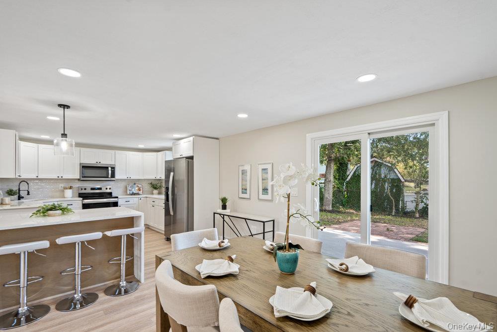 Stunning Colonial in the heart of Selden Oaks. Completely redesigned and fully renovated, this home features 5 large bedrooms, 3 full bathrooms, a den, living room, dining room, and a beautifully updated kitchen with all new appliances and island for extra seating. Additional highlights include a two-car garage, abundant closet space, and a versatile loft/bonus area. Brand new upgrades include a new roof, siding, windows, brand-new AC and heating split units, new plumbing and electrical, new driveway, paver walk-way and Belgium-block border detail. Set on an oversized lot, this home is filled with natural light and offers a bright, spacious layout ideal for both everyday living and entertaining.