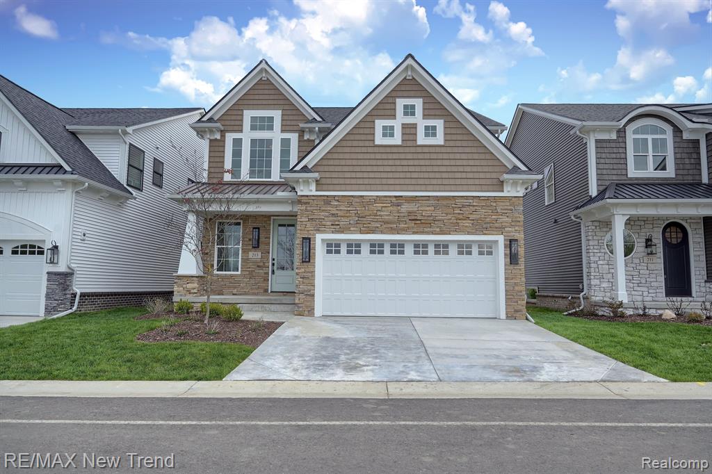Move-in ready at Summit View of Milford, a new development in the bustling downtown district. Craftsman styling with stunning stonework, metal roof accent and shaker siding. Glass-paned front door reveals solid oak floors, intricate trim, Pella windows, and remarkable fireplace. Open kitchen with quartz, huge island for party gathering/meal prep. 2nd floor laundry. Primary bedroom with elegant tray ceiling and walk-in closets. Primary bath dual sinks, large tile shower. Sod/sprinklers and landscape installed. Photos are of actual home. Immediate occupancy. Summit View of Milford, an exciting enclave of 44 architecturally striking, single-family homes located in the bustling downtown district of the Village of Milford, is now open. Enjoy shops and restaurants a short distance away! Be the first to own in this brand-new development. For driving directions to Summit View of Milford set map to 120 W Summit Street, Milford. Photos are of actual home. Equal Housing Opportunity.