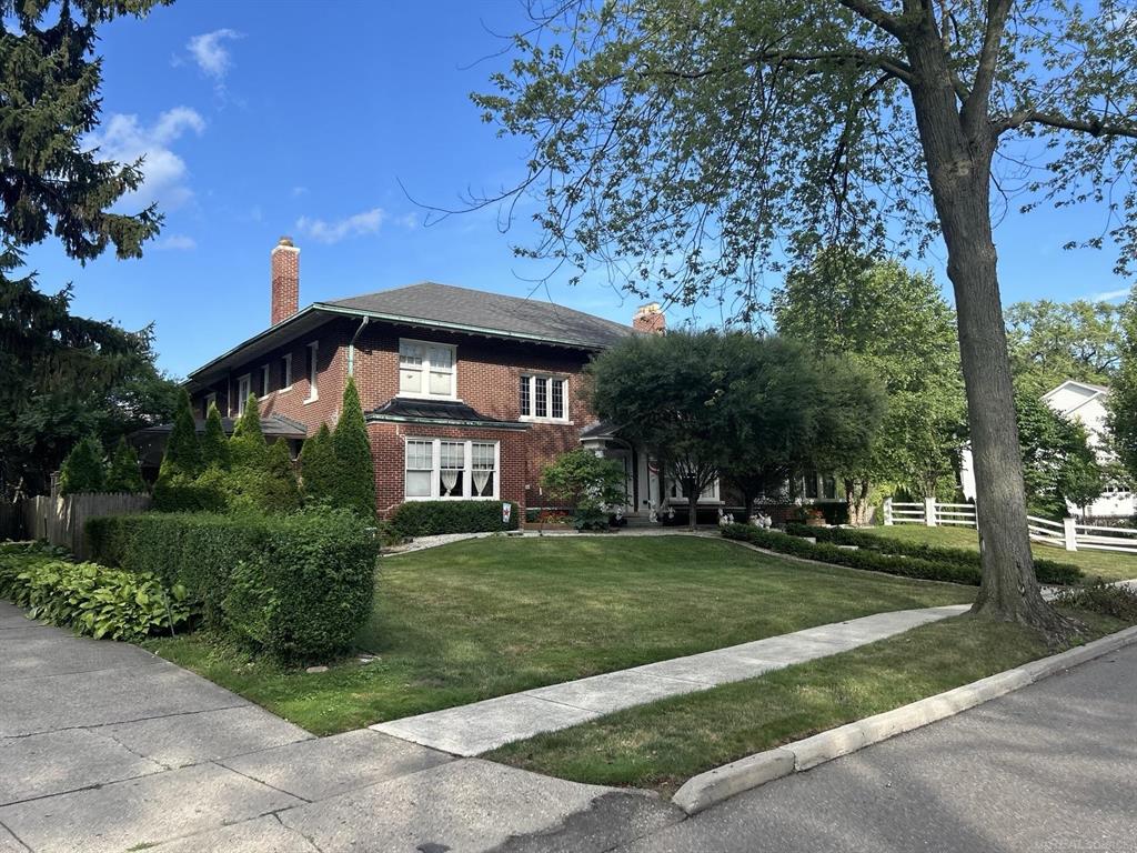 This gracious 3 story, 6/7 bed, 4 bath colonial home is an entertainer's paradise built in 1915 with wonderful architectural detail, large room sizes, and plenty of space for all your guests. Sitting on a one and one-half lot on unique one-way block of University Place, this home has a tasteful blend of modern updates and historic grandeur. The main floor consists of a lovely entry hall with turned staircase, gracious living room, study, large kitchen, 1/2 bath, and a mantuary room that opens to an outside courtyard. Two staircases guide you up to the second floor which consists of 6 bedrooms, 4 full bathrooms, a laundry room, and an additional living/flex room. The recently updated primary bathroom features marble tile heated floors, towel warmer, dual shower heads, and dual vanity sinks. The third floor is finished as a bunk room with a living room space and 6 beds. The finished basement consists of recreational area with plenty of room for pool table, shuffleboard, theatre space, and ping pong all at the same time! The basement also features high ceilings, a half bathroom, and a second laundry room. Outside you will find a garage suitable for up to 3 cars, abundant storage on the 2nd floor of the garage, and an integrated lanai that can serve for outdoor dining, entertaining, or relaxing. This home features a copper gutters, whole house generator, tankless water heater, new boiler (2022), sprinkler system, A/C, and beautifully landscaped grounds perfect for entertaining. Enjoy easy access to Neff Park's private waterfront and marina, The Village and The Hill shopping districts, and top-rated schools including Maire Elementary and Grosse Pointe South High School.