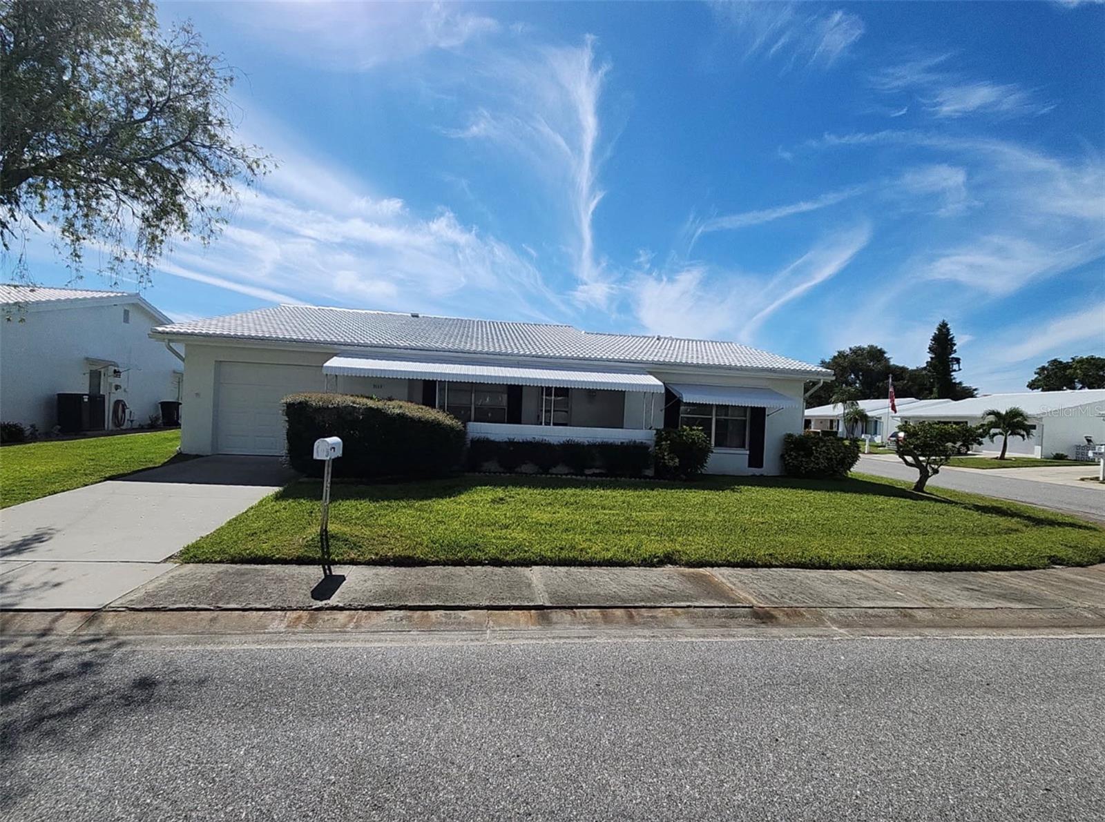 Beautifully renovated home in the Mainlands of Tamarac by the Gulf! This updated 2-bedroom home offers approximately 1,570 sq. ft. of comfortable living space and features a Florida room, open floor plan, luxury vinyl and tile flooring, ceiling fans, eating space in the kitchen, and a living/dining room combination. Major improvements include a 1-year-old HVAC system and 2-year-old water heater. The home also offers a spacious 1½-car garage. Ideally located just 1 block from the community pool and clubhouse, approximately 2 blocks from the golf course, and near US Highway 19 for easy access to shopping, dining, and surrounding areas. Move-in ready and thoughtfully updated throughout, this home offers a great opportunity to enjoy the Mainlands lifestyle in a convenient Pinellas Park location.