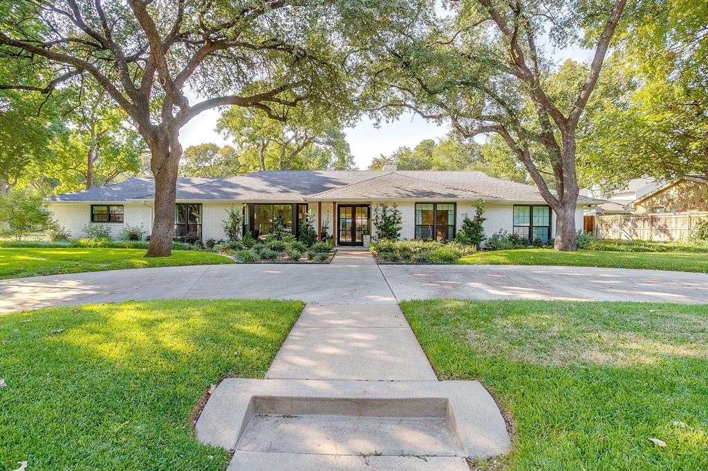 Welcome to this beautifully updated home in the heart of Tanglewood. This special property offers 4 bedrooms and 3.5 bathrooms, including a private guest suite with ensuite bath—perfect for hosting guests. Inside, you'll find two generous living areas and two dining spaces, providing ample room for both everyday living and entertaining. The remodeled kitchen is a true showstopper, featuring modern finishes, a gas range and plenty of storage. The primary suite has also been thoughtfully updated with a remodeled ensuite bath offering a spa-like retreat. Perfectly located within walking distance to Tanglewood Elementary School, this home sits on a spacious corner lot with a convenient circle drive, plus additional parking and garage access from Chaparral. Step outside to a backyard oasis, complete with mature landscaping with landscaped lighting, a storage shed, built in mosquito misting system and plenty of space to relax or play. New windows throughout the whole house! Don’t miss this opportunity to own a versatile, well-maintained home in one of the area’s most desirable neighborhoods!