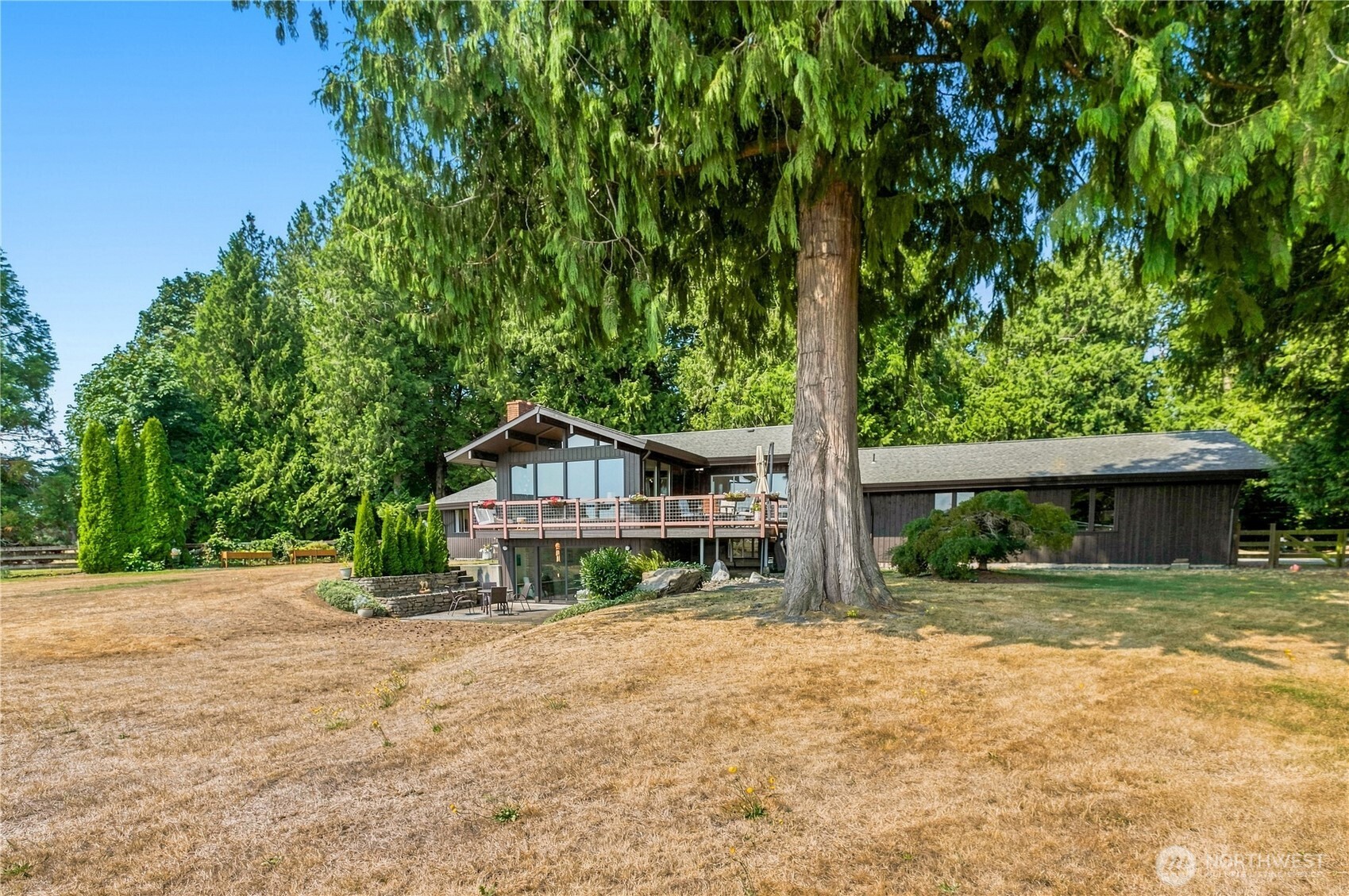 A rare mid-county opportunity in the Lynden School District!  Set on 2.85 private, park-like acres with beautiful Mt Baker and Twin Sister views, this versatile property features two homes plus an impressive 36'x60' insulated and heated shop.  The 2,500 SqFt main home has been recently remodeled and offers mid-century character with vaulted ceilings, exposed beams, a rock feature wall, gas fireplaces and expansive picture windows capturing the mountain views.  With 4 bedrooms, 2.5 baths, multiple living spaces and an oversized 2 car garage/workroom, there's room for it all!  A separate 1,030 SqFt single-level home offers 3 bedrooms, 2 baths, it's own driveway and added privacy.  The shop includes a crane and office space, ideal for work, hobbies, equipment or storage.  Mature cedar trees, fenced yards, circular driveways and a peaceful setting complete this unique property just minutes from Lynden.