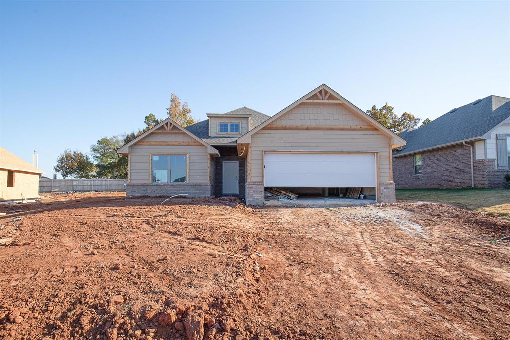 This Dane floor plan features 1,830 Sqft of total living space, which includes 1,700 Sqft of indoor space and 130 Sq Ft of outdoor living. This spacious home offers 4 bedrooms, 2 full baths, 2 covered patios, a utility room, a mudbench for additional storage, and a 2-car garage with an in-ground storm shelter installed. The sizeable living room welcomes high ceilings with a ceiling fan, a center gas fireplace with our stacked stone surround detail, large windows, Cat6 wiring, and wood-look tile. The kitchen supports custom-built cabinets to the ceiling, stunning pendant lighting, 3 CM countertops, a center island, a large corner pantry, modern tile backsplash, and stainless-steel appliances. The primary suite has a sloped ceiling detail with a ceiling fan, our cozy carpet finish, and windows. The attached bath features a dual sink vanity with framed mirrors, 3 CM countertops, a free-standing tub, a private elongated toilet, a European walk-in shower, and a HUGE walk-in closet. Secondary bedrooms feature sizeable closets, carpeted flooring, windows, and ceiling fans. Covered outdoor living area offers a wood-burning fireplace, a gas line, and a TV hookup. Other amenities include our healthy home technology, a tankless water heater, R-44 insulation, a whole home air purification system, and MORE!