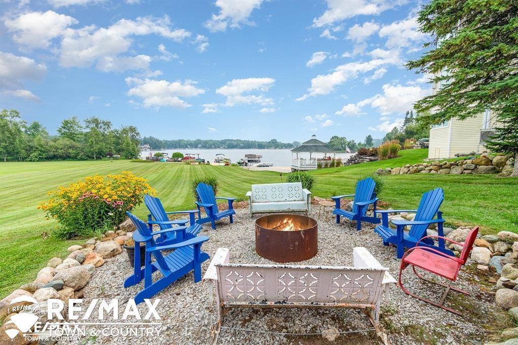 Lake Lancer in Sugar Springs. Welcome home with over 4,000 sq ft of beautifully designed living space sitting on .60 acres with 70 ft of frontage on Lake Lancer in the heart of Sugar Springs. This stunning 4 bedroom 3 full bath home delivers space, comfort, and panoramic water views from nearly every main living area. Whether you're starting your day with a coffee or hosting a weekend getaway, the scenery never disappoints. This home has so much to offer. Come relax in your living room, family room, sunroom, 2 kitchens, a separate dining room/office/bonus, large bedrooms and so much more. Buy today and enjoy all the seasons with your family making memories on the water. Located in the sought after Sugar Springs community, you'll have access to top tier amenities: a clubhouse, 18 hole golf course, pool, restaurant, private beaches, fitness center and so much more. https://sugarsprings.net/ Whether you're searching for a full time residence or the ultimate getaway this Lake Lancer gem checks every box.