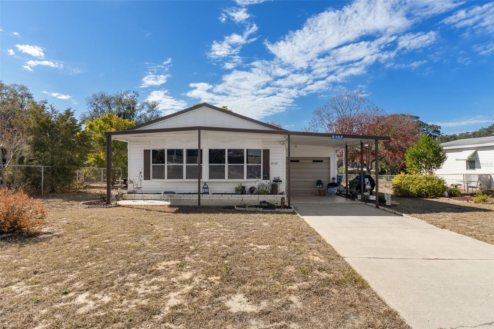 Welcome to your dream home! This beautifully maintained 3-bed, 2-bath residence comes fully furnished and move-in ready. Enjoy everyday Florida living with generous front and back patios perfect for relaxing and entertaining. The spacious enclosed Florida room adds versatile living space filled with natural light. Inside, a completely updated interior showcases a large galley kitchen with a stylish coffee bar, ideal for morning routines and casual gatherings. With an attached garage and quality upgrades throughout, this home offers comfort, convenience, and charm in every corner. Located in the vibrant High Point Golf Community, this home offers resort-style living in a friendly, active 55+ neighborhood. The High Point Community offers tons of amenities such as Golf, tennis, pickleball, heated pool, social events and so much more. High Point is located close to shopping, restaurants, entertainment, and medical facilities. Low HOA fees and you OWN YOUR OWN LAND.Don't miss this move-in-ready opportunity!