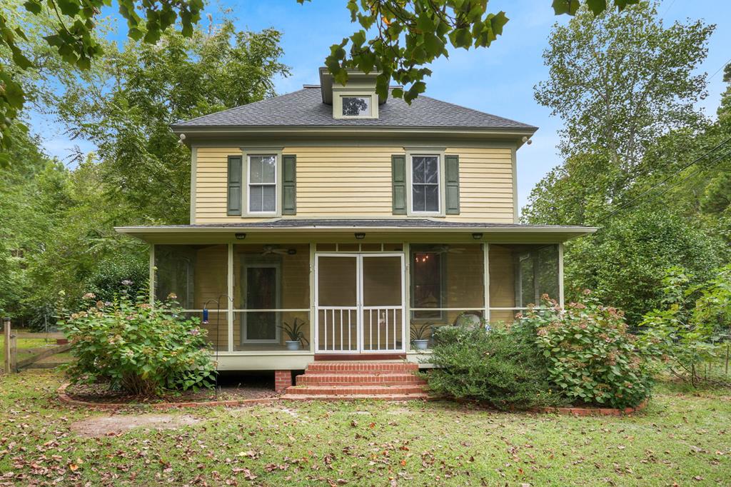 Enjoy serene country living in this beautifully renovated 3BR, 2BA, 2-story home on nearly 10+acres . A grand foyer with original moldings and rich hardwood floors leads to a spacious living room, dining room with gas fireplace, and a remodeled kitchen with granite counters, large island, and built-in corner cabinet. Relax in the bright sunroom, screened porch, or on the expansive rear deck. Main level also features a full bath with laundry. Upstairs offers 3 bedrooms (2 w/ cedar closets), full bath, and walk-up attic storage. Outdoor living includes a fenced yard and multiple outbuildings: a charming cottage & shed w mini splits plus an extra shed. Nearby town dock offers fishing, crabbing, & free boat ramp access to Pungoteague Creek & the Bay. There is a 72 hour kickout clause in place.