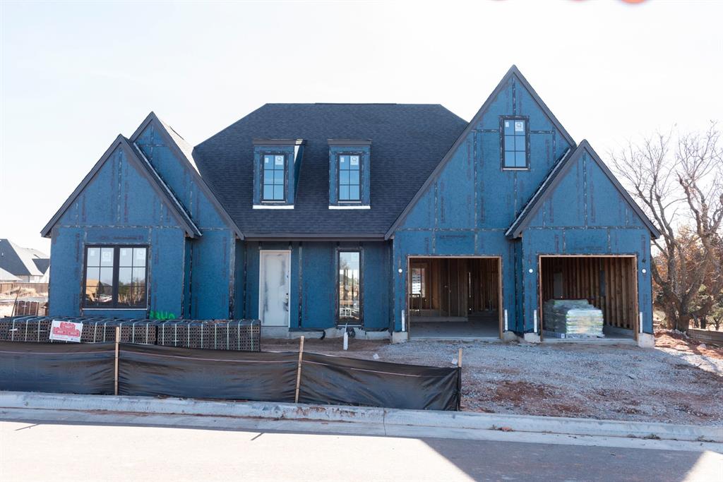 This thoughtfully designed new construction home in Cross Timbers blends timeless style with everyday functionality. Offering 3 bedrooms, 2.1 baths, and a flexible layout, the home features warm architectural details throughout—arched openings, natural earthy accents, and carefully selected finishes that feel both elevated and inviting. The main living spaces flow effortlessly into the kitchen anchored by a statement vent hood, custom cabinetry, and a spacious island—perfect for daily living or entertaining. Additional features include a dedicated pocket office that offers a quiet, built-in workspace without sacrificing square footage, a convenient main-level powder bath ideal for guests, and a versatile rumpus room that serves as the perfect bonus space for movie nights, playtime, or a secondary lounge. From the curated exterior materials to the warm, modern interiors, every detail of this home was designed with care. Located in sought-after Cross Timbers, this home offers the comfort of new construction with the character buyers are looking for. Estimated completion spring of 2026.