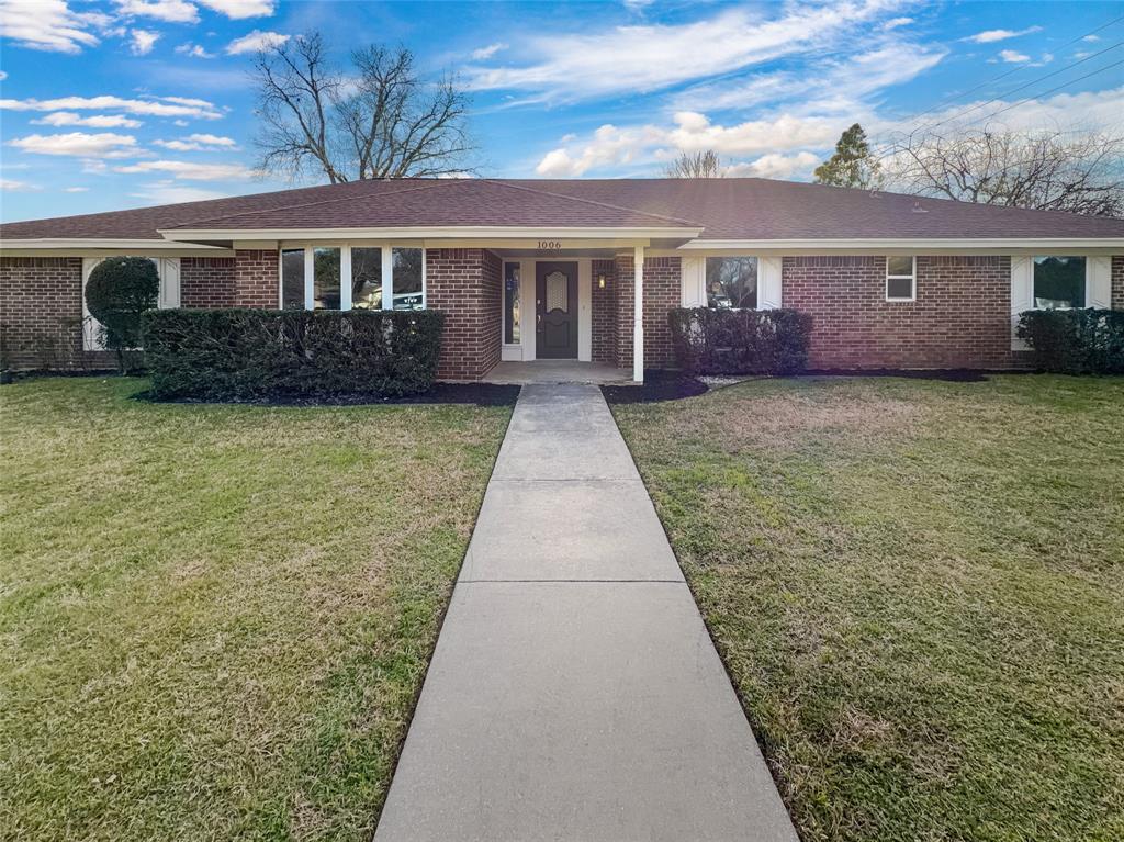Welcome to 1006 Trophy Club Dr, a home that exudes charm and sophistication. The living room is graced with a cozy fireplace, perfect for those chilly evenings. The kitchen is a chef's dream, boasting all stainless steel appliances and an accent backsplash that adds a touch of elegance. Retreat to the primary bathroom, complete with double sinks for your convenience. The fenced-in backyard provides privacy and security, while the covered patio is ideal for outdoor entertaining. The home has been recently updated with fresh interior and exterior paint, giving it a clean and modern look. New flooring throughout the home adds to its appeal. This property is more than just a house, it's a lifestyle. Don't miss out on this gem! Home comes with a 100-Day Home Warranty and a 7-Day Home Test Drive to move in 7 days early for free