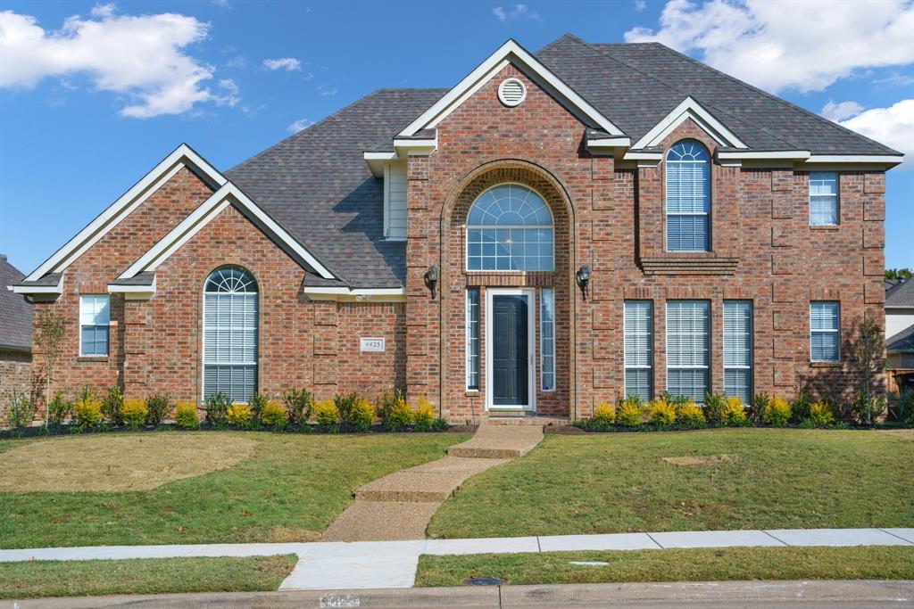 Move-in ready 4-bedroom, 3-bathroom two-story home with great bones! Enter through the entryway with tall ceilings and a formal dining room to your left. The living room features dark hardwood floors, a gas fireplace, and windows overlooking the backyard. The large kitchen offers abundant storage, an island, breakfast nook, pass-through with bar seating, and a built-in desk area. The main level includes 2 bedrooms and 2 full bathrooms. The primary suite features an ensuite bath with a large jetted tub, double vanity, and 2 separate walk-in closets. Upstairs, 2 additional bedrooms share a bathroom, and there's a large flex space ideal for a playroom or media room. The private backyard offers a blank canvas with fresh sod, complete fencing, and a patio pad. New front landscaping completes this opportunity to make it your own!