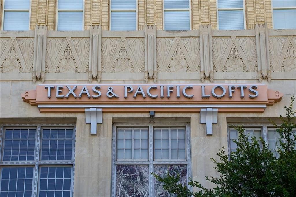 Experience the perfect blend of historic charm and modern luxury in the iconic Texas & Pacific Lofts, one of downtown Fort Worth's most recognizable Art Deco landmarks. This beautifully restored 1-bedroom, 1-bath loft is ideal for those seeking a sophisticated lock-and-leave lifestyle without sacrificing comfort or convenience. Inside, you'll find an open-concept floor plan featuring soaring exposed concrete ceilings, oversized picture windows showcasing stunning downtown skyline views, designer paint, granite countertops, sleek stainless steel appliances, and contemporary finishes throughout. The kitchen flows seamlessly into the spacious living area, creating the perfect space for entertaining or relaxing after a day in the city.Residents enjoy an exceptional collection of resort-style amenities, including 24-hour concierge service, secured building access, elevator service, a state-of-the-art fitness center, business center, media room, private resident lounge, entertainment and party spaces, a resistance pool, and complimentary high-speed internet and cable. For commuters, the location is second to none, offering direct access to both TexRail and TRE commuter rail, providing effortless travel to Downtown Dallas and DFW International Airport.Perfectly positioned in the heart of downtown Fort Worth, you're just steps from Sundance Square, the Fort Worth Water Gardens, the Convention Center, world-class dining, shopping, nightlife, and entertainment. The home also includes a washer, dryer, and refrigerator, making it truly move-in ready. This is a rare opportunity to enjoy luxury urban living in a historic Fort Worth landmark—offering more lifestyle, more convenience, and more value than you ever imagined. Don't miss your chance to call the Texas & Pacific Lofts home!