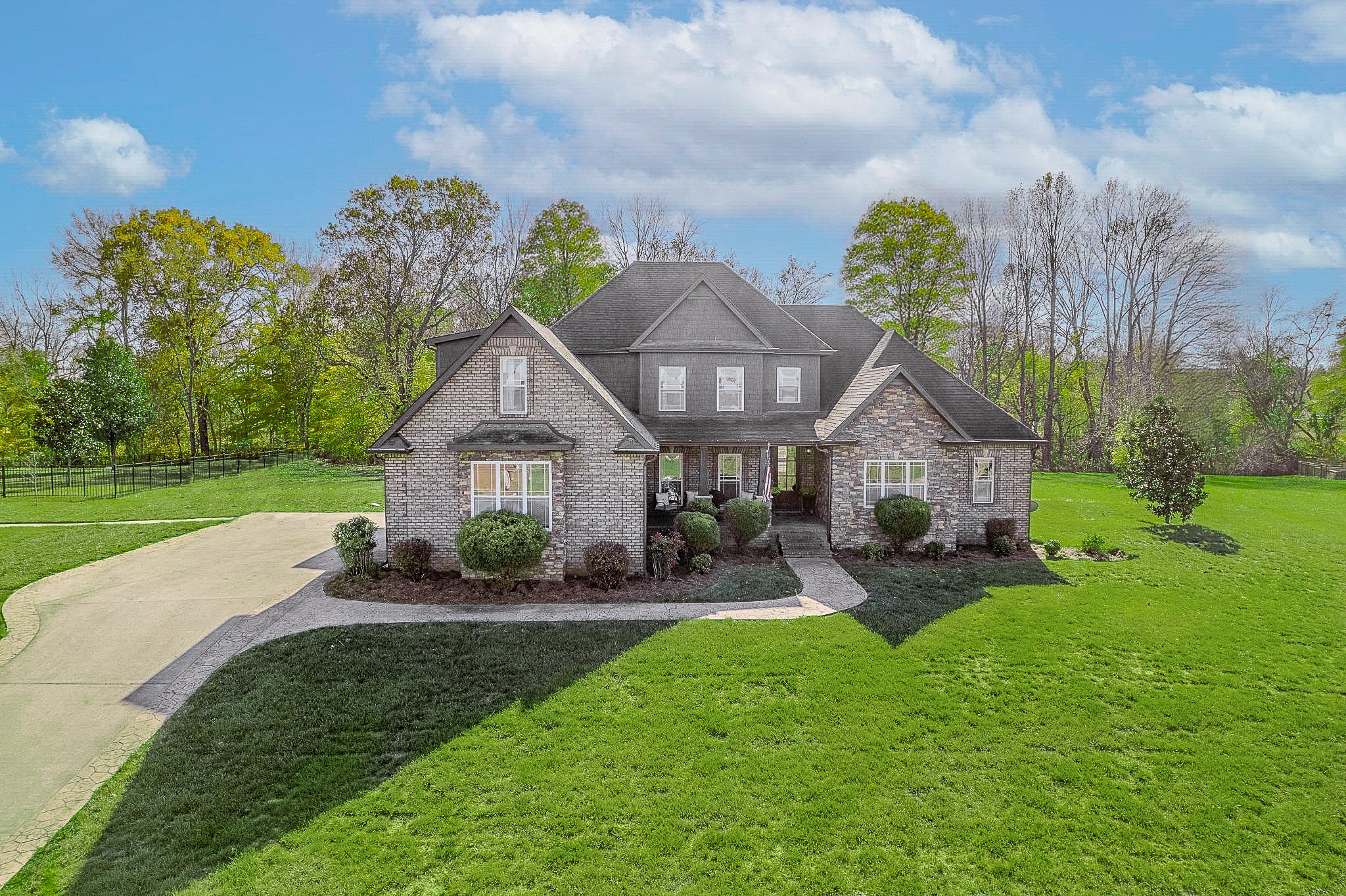 Welcome to a remarkable opportunity—this home is being offered below its appraisal value. Recently enhanced with a brand-new roof (March 2026) and a transferable warranty, this beautifully custom-built residence is nestled on over two acres in the highly sought-after Port Royal Estates. Boasting four bedrooms, four full bathrooms, and an expansive bonus room, this home is designed to impress. The inviting atmosphere and thoughtful design ensure you feel at home from the moment you arrive.The main floor features the inviting primary suite, as well as a versatile second bedroom that could serve as an in-law suite or nursery. Upstairs, bedrooms three and four enjoy access to a charming homework or desk area—ideal for study, creativity, or remote work. Enjoy the peace of mind and privacy afforded by no HOA, no city taxes, and no backyard neighbors.The formal dining room and living room, with their vaulted ceilings and cozy fireplace, set the stage for comfortable gatherings and special occasions. The well-equipped kitchen includes a breakfast area, double ovens, a spacious island, a sitting area with its own fireplace, and a walk-in pantry—making it an inviting hub for both everyday living and entertaining. The spa-inspired primary bathroom features heated tile floors, and every additional bedroom includes its own private bathroom, ensuring comfort for family and guests alike.The versatile bonus room, complete with a kitchenette, is perfect for family entertainment or accommodating overnight guests. Step outside to enjoy a covered patio and a partially fenced yard—wonderful spaces for relaxing or hosting friends and loved ones. The three-car attached garage offers ample space for vehicles, hobbies, and storage needs.Venture outside to discover a charming wet-weather creek and abundant local wildlife, creating a truly inviting and tranquil retreat. Additional highlights include underground utilities and an exceptional location—just one minute from scenic Port Royal.