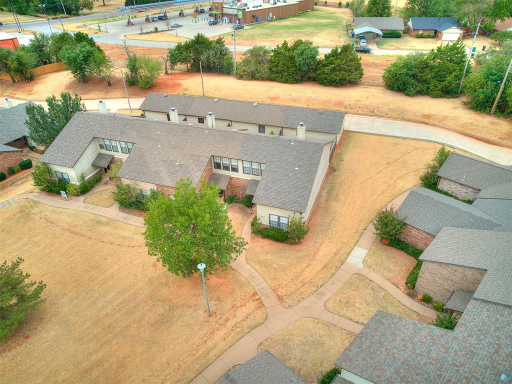 Welcome to this beautifully maintained 2-bedroom, 2-bathroom townhome in The Crossings, a desirable Edmond community offering an unbeatable combination of comfort, convenience, and amenities. Ideally located near shopping, dining, and two major highways, this home provides easy access to everything Edmond and the surrounding area have to offer. Inside, you’ll find a functional and inviting floor plan featuring a spacious living area with fireplace, dining space, kitchen, laundry area, and generously sized closets. The thoughtful layout offers one bedroom and a full bathroom conveniently located on the main level, while the second bedroom and full bathroom are located upstairs, providing flexibility and privacy for guests, family, or a home office. Recent improvements include new flooring throughout, new storm doors, and a roof and gutters that are approximately two years old. The home also includes the washer and dryer, making it truly move-in ready. Step outside to enjoy the covered back patio overlooking the fully fenced backyard—a private space perfect for relaxing, entertaining, or enjoying your morning coffee. A concrete pathway provides easy access from the home to the oversized detached garage, offering excellent storage and parking space. Residents of The Crossings enjoy an array of community amenities, including an outdoor swimming pool, playground, clubhouse, basketball court, and tennis court. With its convenient location, desirable floor plan, recent updates, private outdoor space, and fantastic community amenities, this Edmond townhome is one you won’t want to miss!