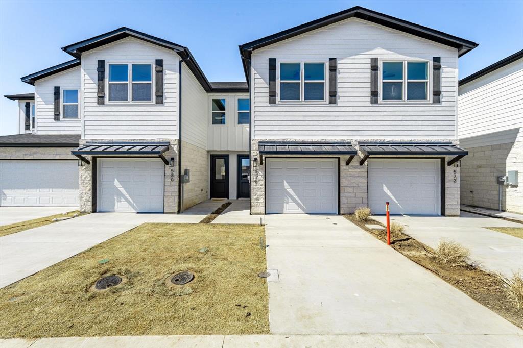 Introducing Tarleton Crossings
Discover Tarleton Crossings beautiful luxury townhomes located a short distance to Tarleton  State University, restaurants and entertainment. Tarleton Crossings offer a maintenance free lifestyle with fully sodded yards shrubbery and sprinkler system all maintained by the HOA. These beautiful townhomes are boasting with 9 ft. ceilings on the first and second floor, beautiful shaker style soft close cabinets with stone counter tops on the first floor with undermounted sink, stainless steel appliances and built in microwave. Decorative light fixtures and canned lighting according to residence plan. Step outside to your own peaceful sitting area on a 10 x 10 concrete patio with decorative fencing 15 feet from the back of the residence. Upgraded packages are available, including furniture and full-size washer and dryer packages. Tarleton Crossings are great for families, students, long and short term rentals.