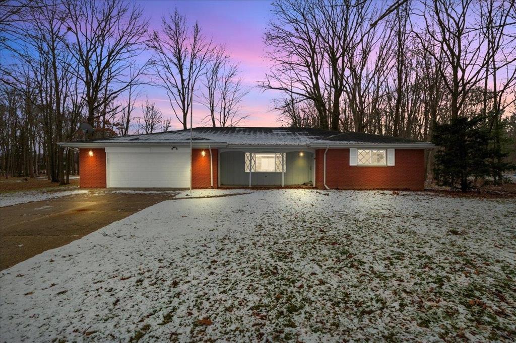 Sprawling 3-bedroom, 2-bath brick ranch situated on 33+ acres in Swan Creek Township, offering nearly 3,400 sq ft of total living space between the main level and the full basement. The main floor features approximately 1,800 sq ft with recent updates, large windows throughout, and beautiful views of the surrounding land. The expansive basement spans nearly 1,800 sq ft, providing endless potential for additional living or recreational space. Outbuildings include a massive 54' x 64' heated outbuilding complete with a bathroom, on-demand water heater, and laundry, along with a 20' x 50' pole barn ideal for storage, equipment, or hobbies. The property is highlighted by a stunning 11-acre pond featuring a beach area, multiple docks, and a gazebo-perfect for fishing, swimming, or relaxing. Additional acreage includes wooded land ideal for trail riding, hunting, or enjoying nature. Additional features include a 2.5-car attached garage, motocross track, and public water. Whether you're seeking a hobby farm, recreational retreat, or peaceful homestead, this one-of-a-kind property offers it all.
