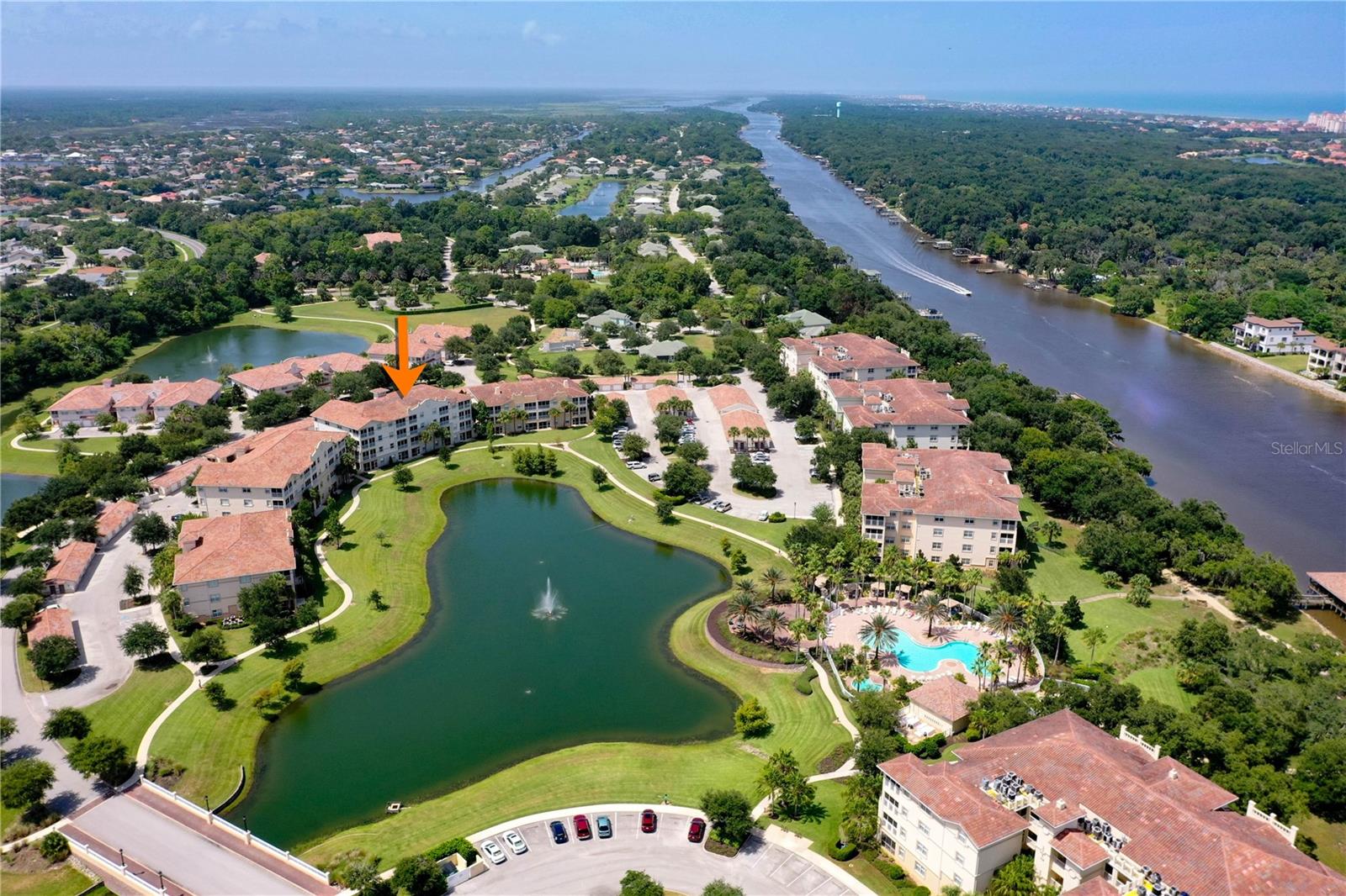 Discover a rare opportunity in Tidelands with this bright and inviting second floor residence overlooking the community’s main lake and fountain, with views extending toward the Intracoastal pool and the Intracoastal Waterway beyond. What truly sets this condo apart is the beautifully renovated kitchen. Unlike the standard two tiered eat in counter found in these floor plans, this residence has been redesigned with an island featuring the kitchen sink, creating a more open, functional gathering space and a layout rarely available within the community. The thoughtfully designed split floor plan offers privacy for the Owner’s Suite, which enjoys direct access to the screened lanai along with a lakefront window perfectly positioned for a desk, reading area, or simply enjoying the view right from bed. Triple sliding glass doors with tinted glass invite in abundant natural light while helping soften the morning and afternoon sun. The interior feels fresh and relaxed with soothing sage green and white accents complemented by warm wood furnishings. Tile flooring flows through the main living areas, while the bedrooms feature wood look LVT, with no carpet anywhere. Guest bedrooms are finished with classic Plantation Shutters. Enjoy your morning overlooking the lake and fountain, then step outside your front door and onto the open air balcony to take in beautiful western sunsets. The building also offers an elevator for convenient access, and the residence includes a spacious private storage unit with parking conveniently located in front of the building. Furniture is negotiable, and the home may be purchased turnkey furnished, with the exception of select personal items, making this an especially attractive option for a second home, seasonal residence, or an easy Florida getaway. And then there is the Tidelands lifestyle. This gated Intracoastal community offers underground utilities, building pest control systems and an impressive collection of amenities designed to make everyday life feel a little more like vacation. Choose between two resort style pool experiences, the clubhouse pool which is heated year round, or the spectacular Intracoastal front pool complete with cabanas, lounge areas, restrooms and heated spas. Follow the community’s miles of natural and finished walking paths, including more than a mile directly along the Intracoastal Waterway, with lighted pathways and convenient pet stations along the way. Cast a line from the Intracoastal fishing pier, relax beneath the covered waterfront pavilion, or stay active with tennis, pickleball, basketball, billiards, table tennis, foosball and a fitness center. The community also features an onsite café space available for private events, onsite management and secure gated entry. At 75 Riverview Bend S Unit 1624, you are not simply buying a condo, you are stepping into a lifestyle of water views, sunshine, recreation and relaxation in one of Palm Coast’s best kept secrets. Feel like you’re on vacation every day, discover your lifestyle at Tidelands on the Intracoastal.