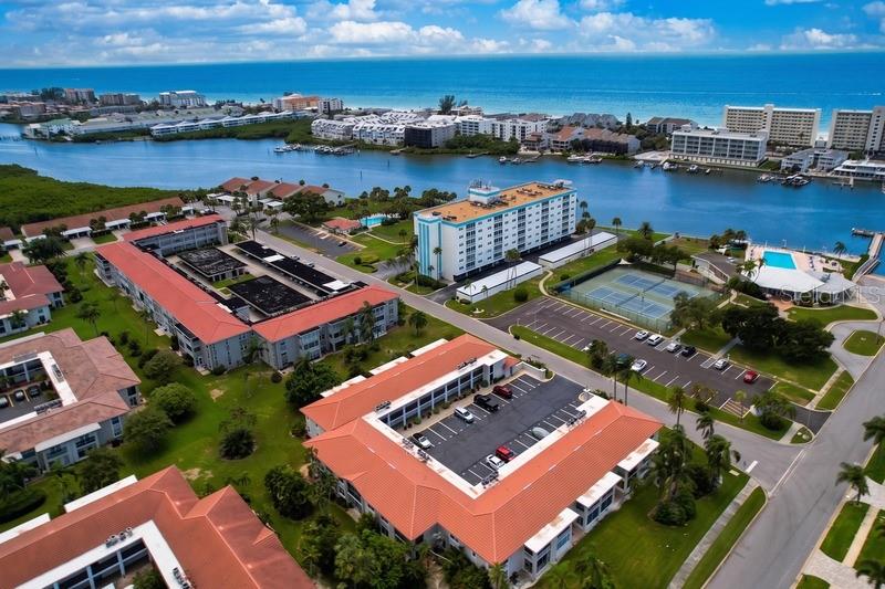 Welcome to Imperial Point—where waterfront Florida living meets the Gulf lifestyle! Located along the Intracoastal Waterway and just around the corner from the beautiful shores of Indian Rocks Beach, this rarely available first-floor corner condo offers the perfect combination of comfort, convenience, and resort-style amenities. Featuring 2 bedrooms and 2 full bathrooms, this spacious condo offers an open-concept layout, renovated baths, and a large lanai that opens to your private patio—a special perk enjoyed by only select first-floor residents. It’s the perfect spot to relax, entertain, and enjoy the beautiful Florida sunshine. Recent updates include a brand-new water heater and garbage disposal installed in August 2026, new flooring throughout, and a new A/C system installed in July 2024. An inside laundry room can also be added, offering an opportunity for even more convenience. Just across the street, the main clubhouse sits along the Intracoastal and offers an incredible array of amenities, including a heated pool, fitness room, game room, library, tennis courts, pickleball courts, community boat ramp and dock. The property also features a second clubhouse and pool complete with waterfront views and BBQ areas for outdoor entertaining. Whether you're looking for a full-time residence, a Florida getaway, or an investment opportunity, Imperial Point delivers the laid-back coastal lifestyle you've been looking for. Enjoy waterfront amenities, nearby beaches, shopping, dining, and easy access to Tampa International Airport—all in one fantastic location!