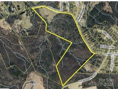 Over 85 acres!! Mostly wooded w/streams on property. Zoned residential. Parcel S of Calico Rd: Zoned RA-20, outside city limits. Property adjoins Foothills Regional Airport. Call today for more information and details to help you understand the property and all that it offers. Schools: Gamewell Elem, Gamewell Middle, West Caldwell High. Contact Gamewell town office and Caldwell County for any restrictions on use, utilities, etc. ***Confirm w/Caldwell County Prop. Tax office what new owners property taxes will be. Current Property tax bill will not reflect next owner's tax bill***Land is currently part of a forestry program that changes the property tax amount.