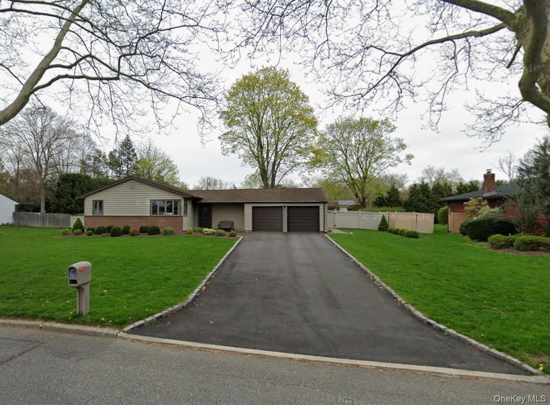 Welcome to this beautifully maintained ranch-style home nestled on a quiet, tree-lined street just a few houses down from Harley Avenue School in the highly ranked Elwood Union Free School District. Everything you need from shopping to dining to parks - located just a few blocks north and south of this property. This inviting home offers 3 spacious bedrooms and 2 full bathrooms, (Two bedrooms and a shared hall bath and a primary suite with separate bathroom), along with a two-car attached garage with interior access. Hardwood floors are in impeccable condition, adding warmth and charm. The sun-filled eat-in kitchen with a beautiful bay window opens to a comfortable living room and dining room combination—ideal for everyday living and entertaining.. Step down into the cozy sunken den featuring classic wood-paneled walls, a built-in bar and sliding glass doors that lead directly to the patio and fenced-in shy half acre backyard, creating a seamless indoor-outdoor experience. The property also includes in-ground sprinklers to keep the landscaping looking its best.The fully finished basement expands your living space and is ideal for entertaining, complete with a large recreation area, laundry room, storage space, playroom, and a private office—perfect for today’s flexible lifestyle needs.Major updates include a newer Roth oil tank in the basement, oil burner, and roof, offering peace of mind for years to come. Central air and utilities are regularly maintained. This well-cared-for house combines comfort, functionality, and a prime location—don’t miss the opportunity to start making your own memories in your new home.