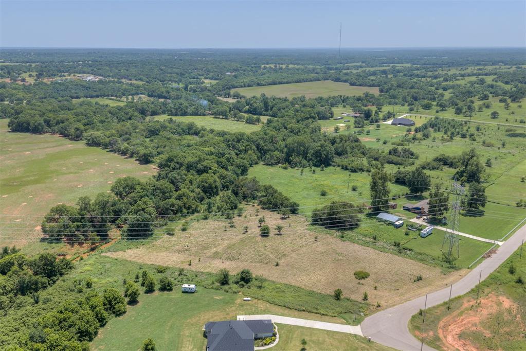 Build your dream home on this beautiful 4.967 acres home site located in the desirable Yanez ranch community, this property offers the peace and privacy of country living with the convenience of paved road and easy access to Norman, Moore, and Oklahoma City. Minimum build requirement: 1,800 sq. ft. With plenty of room for a custom home, shop, barn, and outdoor recreation, this acreage provides endless possibilities. Livestock is welcome (no swine permitted), making it an excellent option for those seeking a rural lifestyle.The property will require installation of utilities, giving you the flexibility to design your homesite to fit your needs. Enjoy wide-open space, wonderful Oklahoma Sunsets, and the perfect balance of rural charm and nearby city amenities.Whether you are ready to build now or looking for a great investment opportunity, this land is ready for your vision. Do not miss your chance to own acreage in this growing area- schedule your showing today! The land is located right beside the home 16000 Bohon Way