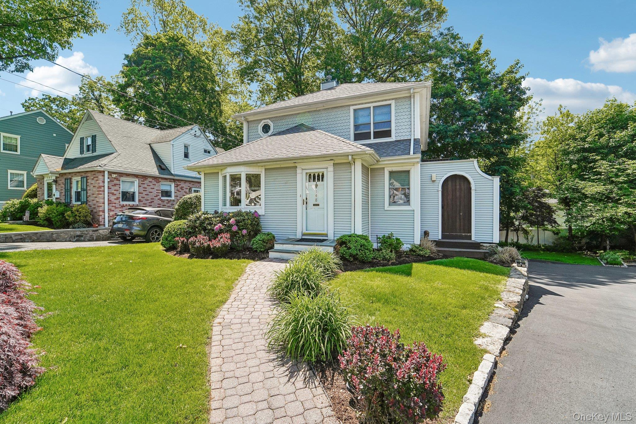 Welcome to 148 Seacord Road — a move-in ready gem tucked away on a peaceful cul-de-sac and surrounded by serene nature preserve. This picture-perfect home combines warmth, comfort, and effortless living with beautifully sunlit interiors and an inviting layout designed for both everyday living and entertaining. Step inside to a bright and airy living room featuring elegant French doors that open to a deck — the perfect place to relax, unwind, or enjoy morning coffee surrounded by nature. The beautifully appointed kitchen offers both style and functionality, complete with access to an additional deck ideal for outdoor grilling. Open to the dining area, this space creates a seamless flow for entertaining family and friends. The main level also includes a full hall bath, a comfortable bedroom, and a second bedroom currently used as a den, offering flexibility to suit your lifestyle needs. Upstairs, the private primary suite serves as a tranquil retreat with doors leading to its own deck, creating a peaceful escape with lovely natural surroundings. The suite also features a dressing area and an ensuite bath. An additional generously sized bedroom and another full hall bath complete the second level. The lower level provides excellent storage space, laundry area, utilities, and access to the attached garage. Perfectly situated in a quiet, sought-after setting, this special home offers the rare combination of privacy, natural beauty, and convenience — truly a place where you can simply unpack and enjoy.