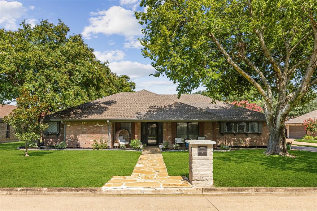 Charming and thoughtfully updated 4-bedroom, 2-bath home in the heart of Trophy Club, ideally situated on a quiet cul-de-sac just minutes from the golf course, Grapevine Lake, and local amenities. Built in 1978, this home blends timeless character with modern updates, offering a functional split layout perfect for entertaining. Step into a spacious living area that flows seamlessly into the updated kitchen, creating an open-concept space ideal for gathering. A cozy see-through fireplace adds warmth and charm, connecting the living and flex areas. The fully renovated kitchen and bathrooms feature contemporary finishes while preserving warmth and personality. The private primary suite is tucked away from three additional bedrooms, and a dedicated office offers the ideal work-from-home setup. Outside, enjoy a spacious quarter-acre lot featuring mature trees, a beautiful covered patio, a charming stone path, and inviting curb appeal.  Located within golf cart distance to dog parks, community pool, Trophy Club schools, restaurants, and scenic trails—this home offers unbeatable convenience and lifestyle. Don’t miss this opportunity to own a move-in-ready home full of character, comfort, and charm in one of DFW’s most desirable communities! Schedule your showing today!