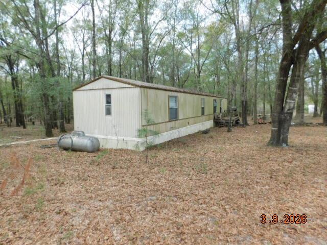 A rare opportunity to own 84.35 acres of prime recreational land in the quiet countryside of Coleman, Georgia. This property is tailor-made for anyone seeking a private hunting camp, a secluded getaway, or the foundation for a future rural homestead. This 84.35-acre tract offers the perfect blend of privacy, natural beauty, and functionality. The property features a meandering stream, diverse timber, and abundant wildlife, making it an exceptional hunting location. A single-wide mobile home sits on the land, complete with private well and septic, providing immediate usability for weekend trips, a hunting camp, or a temporary residence. Whether you envision a quiet rural homestead, a family retreat, or a dedicated hunting property, this land delivers the space, resources, and natural setting to make it happen.
