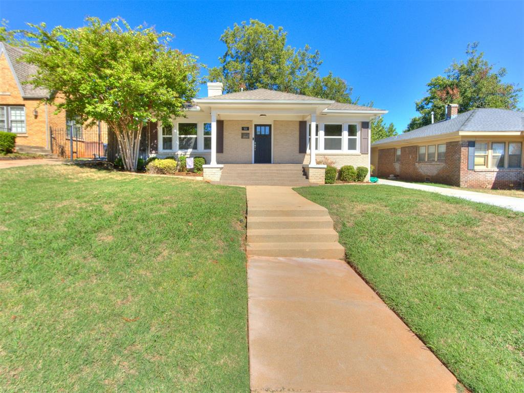 Welcome to 511 NW 33rd Street, where classic Oklahoma City charm meets thoughtful updates and everyday functionality. This 3-bedroom, 2-bath home offers beautiful refinished hardwood floors, abundant natural light and a warm, inviting feel throughout. The remodeled kitchen features custom cabinetry, granite countertops, updated flooring, tile backsplash, modern lighting and appliances, including a new stove installed in 2026. Both bathrooms have also been updated, with the primary bath offering custom cabinetry, granite countertops, a newer shower and updated flooring, while the guest bath features updated flooring, bathtub and tile. The home has received numerous improvements over the years, including double-pane insulated windows, updated light fixtures, newer HVAC, sprinkler system, fresh interior paint and two newer sets of sliding doors. The laundry area includes custom built-in cabinetry for additional storage along with a convenient desk/workspace finished with a granite countertop.  Outside, enjoy a spacious backyard with mature trees, a newer back deck and an expanded concrete driveway with a large paved area in the rear, providing plenty of space for parking, recreation or entertaining. The basketball goal, swing set and storage shed remain with the property. Additional exterior improvements include painted brick, brick paver tile on the front porch and steps, and shutters that add to the homes curb appeal. Conveniently located near the Paseo Arts District, Uptown, shopping, dining and central Oklahoma City, this home offers the character of an established neighborhood with many modern updates.