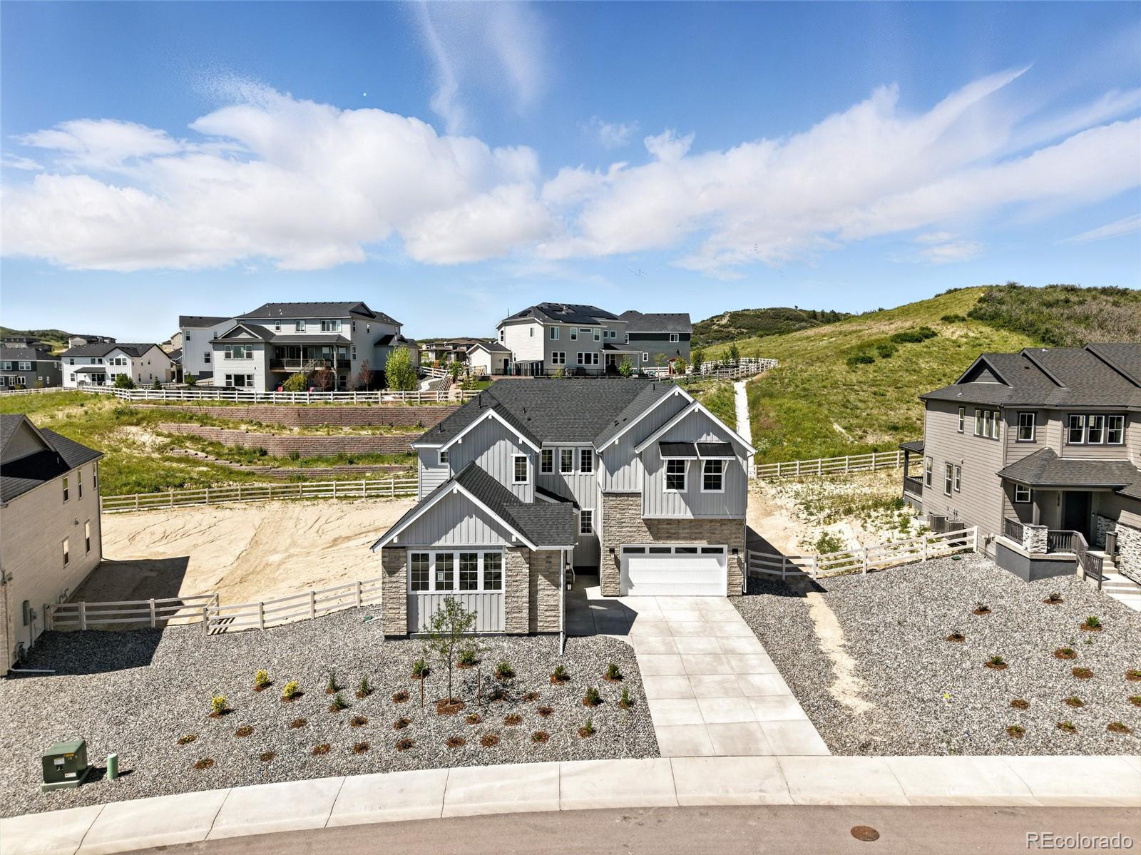 New Construction -   Built by America's Most Trusted Homebuilder - Ready Now! Welcome to the Steamboat at 1672 Fox Trotter Point, at Crystal Valley. This beautifully upgraded home offers the perfect blend of shared spaces and private retreats, ideal for multi-generational living. The private suite includes its own living room, laundry, and direct access to a third-car garage bay. An open-concept layout connects the kitchen, dining, and great room, featuring designer cabinets, quartz countertops, a gas cooktop with vented hood, built-in microwave and oven, single-basin stainless sink, soft-close cabinetry, and a built-in double trash bin. Upgrades continue throughout with extended hard surface flooring, modern trim, two-tone paint, tile on all floors and walls, and stylish railings on both levels. Upstairs, the spacious primary suite offers dual walk-in closets and a spa-like bath. Three additional bedrooms, a loft, oversized laundry, and an extra sink in Bath 2 ensure comfort and functionality for the whole family. Additional highlights include: Air conditioning, covered outdoor living, 8' interior doors, owner's bath configuration 5, double doors at study, modern 42" fireplace and 9' full unfinished basement. MLS#5819549