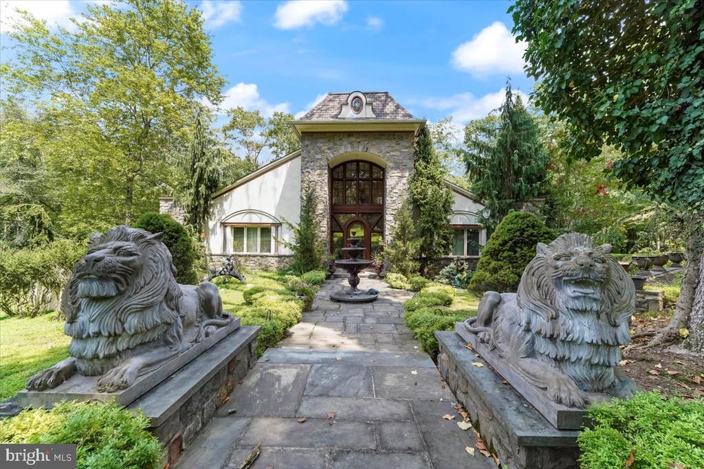 Majestic French Contemporary Estate Overlooking Springton ReservoirWelcome to this stunning French Contemporary Estate set on a spectacular 2.76-acre level lot with breathtaking Springton Reservoir views. Enjoy over 2,000 sq. ft. of veranda space—perfect for entertaining indoors and out.The grand main entrance opens to a spacious foyer with gleaming hardwood floors, soaring ceilings, and exquisite mahogany doors. The great room features a two-sided fireplace, adjoining the elegant dining room (currently used as a music room) and a spacious kitchen with reservoir views. The kitchen opens to a sunlit dining area with fireplace and access to the veranda with a hot tub. Additional main-level spaces include a powder room, sunroom, and laundry room.The first-floor primary suite is a private retreat with veranda access, a two-sided fireplace, two oversized walk-in closets, and a luxurious bath with Jacuzzi tub, large walk-in shower, dual vanities, and mosaic tile flooring. Two additional bedrooms and a full hall bath complete the main level.Upstairs, a large loft offers flexible space—ideal for a billiard room, office, or media area.The finished lower level (approx. 2,000 sq. ft.) includes a bedroom, full bath, sitting room, and great room with walkout access to the beautiful grounds. An additional 2,000 sq. ft. of unfinished space includes a massive cedar closet, providing ample storage or future expansion potential.Outdoor features include fountains, manicured landscaping, and an oversized 3.5-car garage. This extraordinary property offers elegance, privacy, and convenience—just minutes from Ridley Creek State Park, shopping, dining, hospitals, and major routes. Located in the award-winning Rose Tree Media School District.