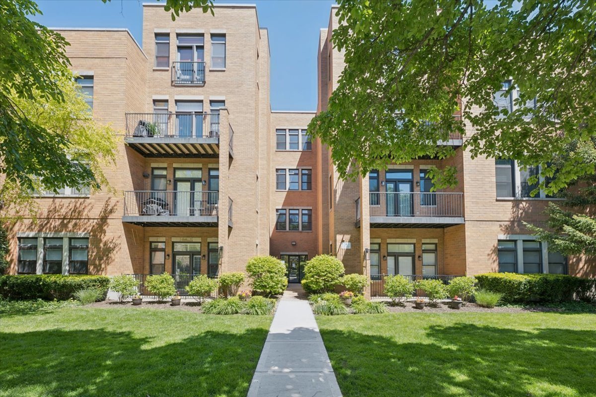 Rarely available and ideally positioned, this ground-level 2-bedroom, 2-bathroom condo puts the best of Evanston right at your doorstep. Steps from the Purple Line, three blocks from the neighborhood's vibrant dining, shopping, Target, and Whole Foods, and just four blocks from Northwestern University-with Kellogg Global Hub a comfortable ten-minute walk away-the location alone sets this home apart.  Inside, the living space is warm and inviting, anchored by a wood-burning gas fireplace that makes the room as cozy in winter as it is welcoming year-round. The layout is thoughtfully designed for everyday comfort, with two well-proportioned bedrooms and two full bathrooms that feel anything but ordinary.  The primary suite is a true retreat, complete with a walk-in closet, dual vanity, and a Jacuzzi tub-everything you'd want to decompress at the end of the day. The second bedroom is generously sized with ample closet space, making it equally suited as a guest room, home office, or nursery.  Step outside to your own private outdoor space-a rare find at this price point and in this location. When it's time to head out, parking for one car is included. Whether you're a Northwestern affiliate, a professional seeking a seamless commute into the city, or simply someone who wants to live well in one of Chicago's most beloved suburbs-this one checks every box.