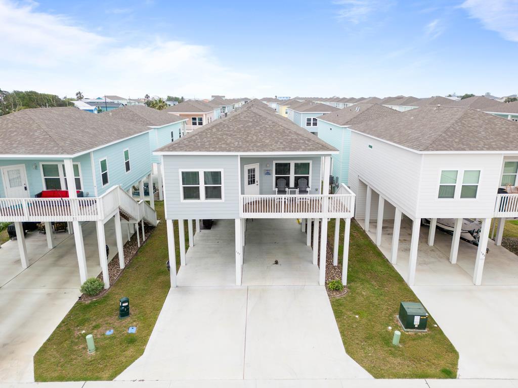 COASTAL CUTIE! Don't miss out on this 3b/2b home located in Ocean Reef Cottages. This home comes furnished and decked out with a Coastal FlairTRIPLE BUNK beds that are custom made are ready for the kids. Fresh costal colors splashed throughout this home. And Custom tiled showers in both bathrooms. Enjoy the breezes from your porch and splash in the community pool. Just minutes from downtown Rockport for dining & shopping. Easy to launch your boat at Cove Harbor Marina. Community features large swimming pool w/bathrooms, dog park area, pond and boat wash station. Summer is here and this home is perfect for you to enjoy!