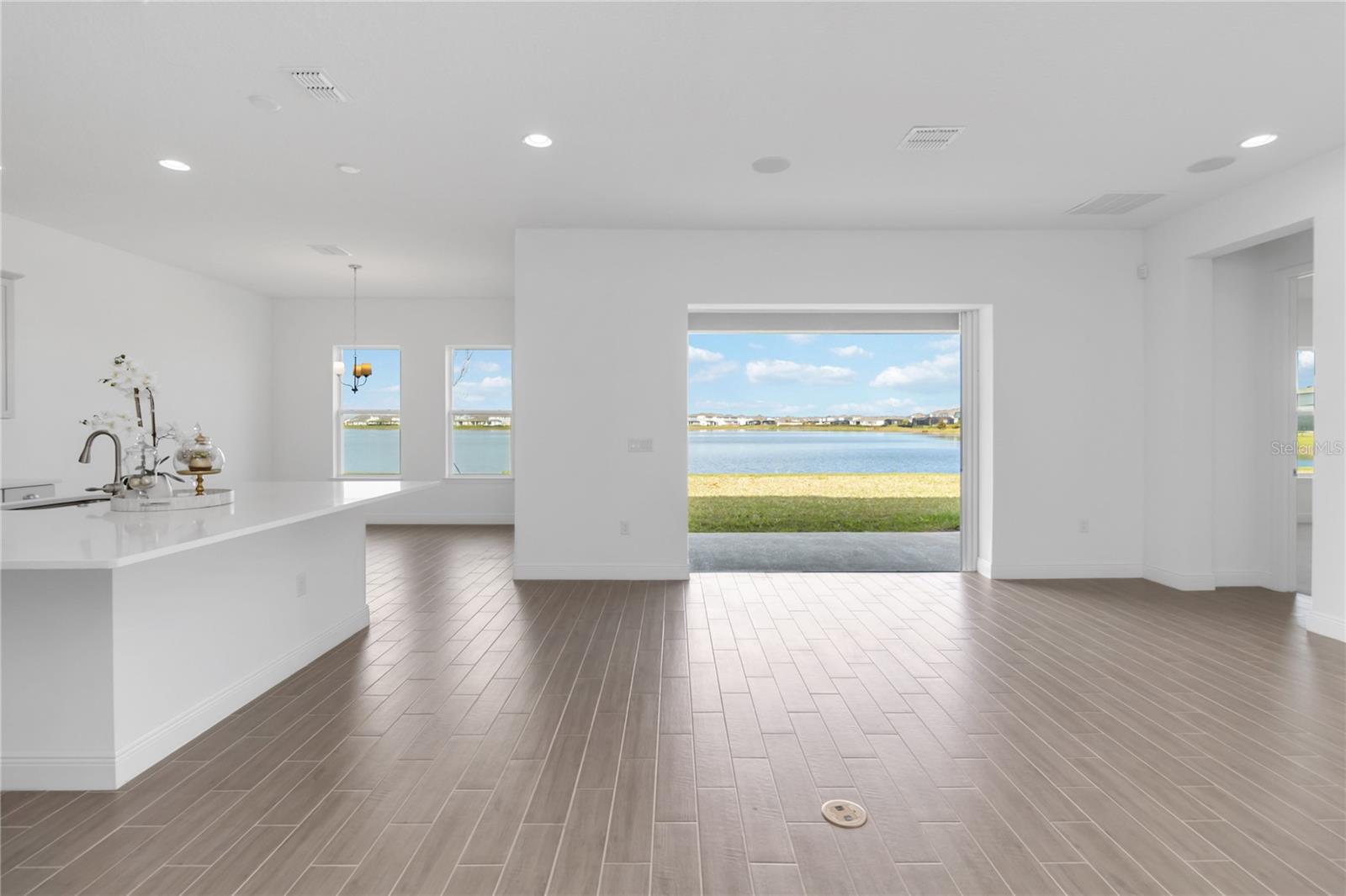 Be the first one to live in this stunning 4 bedrooms, 3 full-bathroom, and 2 half-bathroom home offers an elegant blend of comfort and sophistication, with breathtaking WATER VIEW and mesmerizing sunsets right from your backyard. This home has lots of upgrades.
The primary suite is conveniently located on the first floor, featuring his and hers walk-in closets and a spa-like bathroom with a soaking tub and an oversized shower, perfect for relaxation. Upstairs, a spacious loft provides a secondary living space with gorgeous water views, along with an additional bedroom and full bath, ideal for guests or multigenerational living
The home also includes a flex room downstairs that could be perfect for a home office, art studio, or private gym.
Designed for both style and practicality, the gourmet kitchen is a chef's dream with a pot-filler faucet, beautiful tile backsplash, spacious pantry, and an oversized island, perfect for entertaining friends and family.
Located in Summerdale Park, residents enjoy access to a community pool, kayak launch deck, and picnic area, enhancing the Florida lifestyle. Situated in Lake Nona, one of Orlando's most innovative and futuristic neighborhoods, this home is just minutes from Orlando International Airport, top-rated restaurants, shopping, entertainment, and only 45 minutes from the beach .
Don’t miss the opportunity to own this incredible hone in one of Central Florida's most desirable locations. Seller had a home inspection done before the end of the construction company’s one year warrant period that could be provided to the potential buyers.