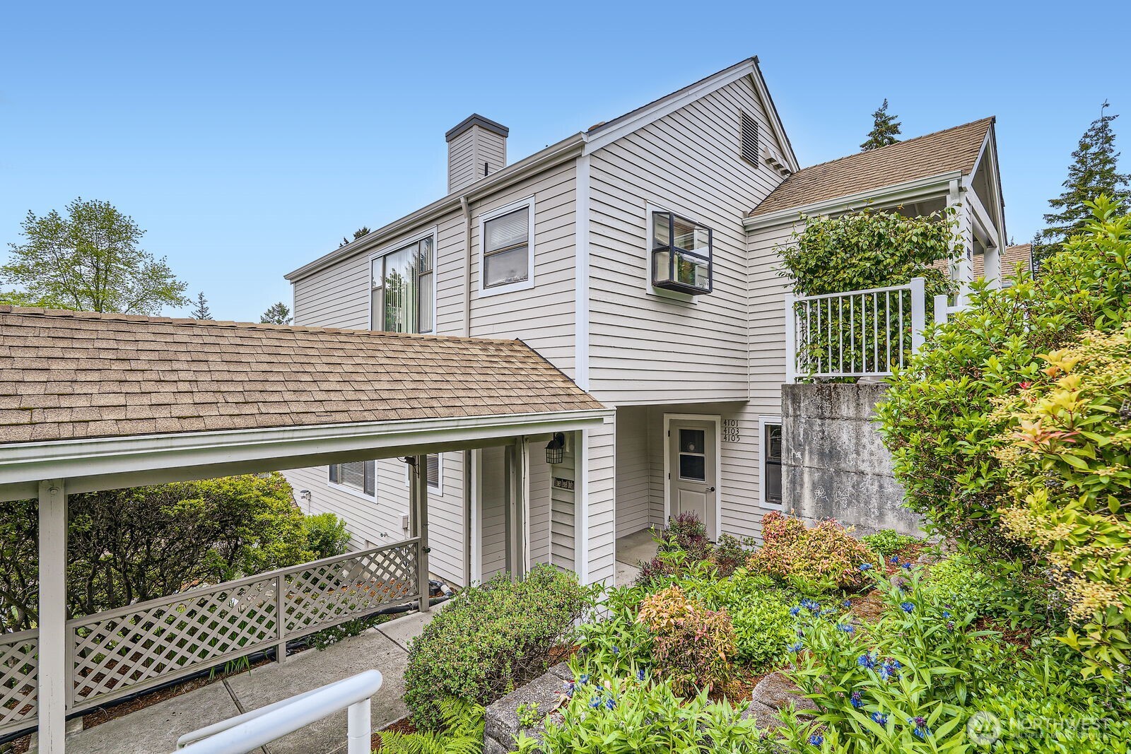 This impeccably maintained 2 bedroom, 1.5 bath end unit has great light & beautiful western territorial views. Most recent updates include brand new carpet in the bedrooms and new SS range & microwave. The spacious primary bedroom boasts expansive closets and a large full bath. Another half bath and 2nd bedroom will accommodate visiting guests. There is a convenient pass-through from the kitchen to the dining area. Motorized shades on all west-facing windows. An electric fireplace with its attractive mantle will warm you on those chilly eves. 2020 furnace is ready for A/C. The oversized garage has room to spare for extra storage. Building exterior & doors were just painted + new deck floor & railings. Enjoy this vibrant community!
