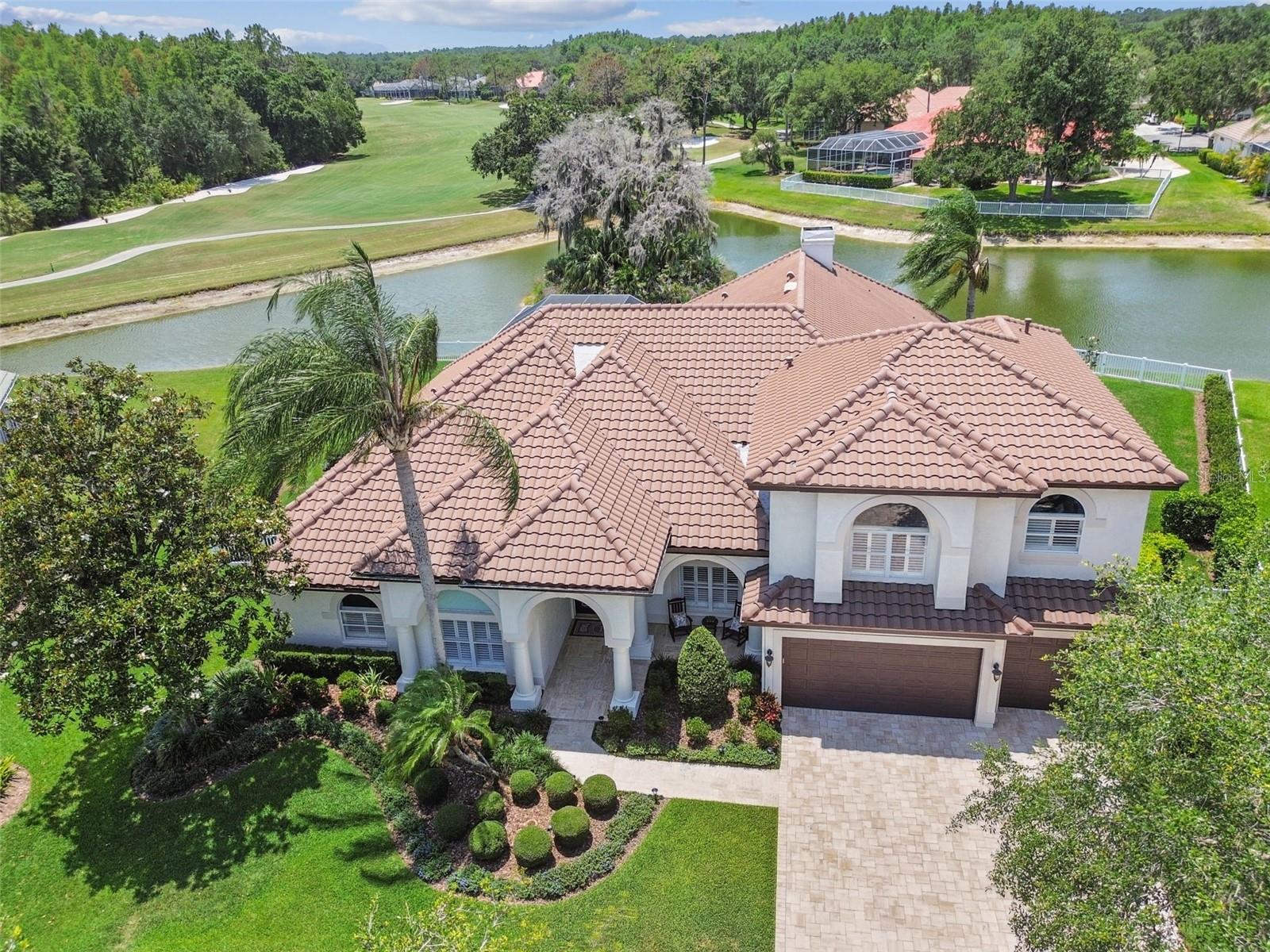 Luxury reimagined, a fully remodeled Hunters Green pool/spa home with golf course view in Osprey Point. This beautiful 4,707 SF 5 bedroom, 4 ½ bathroom, 3 car garage, plus 6th bedroom/office, exercise space and bonus room was built by Hanna Bartoletta to meet your highest standards.  As you enter this magnificent residence you will notice the attention to detail.  The completely remodeled kitchen features high-end stainless-steel appliances including a 48” wolf range with double ovens, pot filler, custom quartz counters, counter height island with farm sink, and a large walk-in pantry all overlooking a large family room with fireplace and built ins. The huge primary suite with sitting area has wonderful views, dual walk-in closets, dual sinks with makeup area, tub and a large walk-in shower.  Upstairs you will find a quiet oasis including a bedroom, bath, large bonus room and an exercise or craft area. Step outside to the oversized covered lanai with outdoor kitchen, and updated pool/spa area with travertine all overlooking serene pond and golf course beyond. Home includes but is not limited to a new tile roof (2023), huge laundry room has dryer, washer with sidekick  for smaller loads(2023), tons of storage and solid surface workspace, plantation shutters, extensive wood flooring, crown molding, new pool motor and filter (2025), salt cell (2026),  water heater (2021), 15 SEER A/C (2023), REME Halo LED air purification system (2024), paver driveway, epoxy garage floor, recently painted inside and out, fenced yard with sitting area, and a sprinkler system.  Hunter’s Green, a gated and guarded community, has become the residence of choice for many moving to the Tampa Bay area because of commuting convenience, quality of life and high number of superior rated schools.  Hunter’s Green Golf and Country Club is one of the finest private clubs in the southeast boasting a championship golf course designed by Tom Fazio, and an avid tennis membership. Located only minutes from shopping, I-75, hospitals, VA, Moffitt cancer hospital, restaurants, recreation, Flatwoods trails and entertainment. Come see for yourself this exquisite residence, sit down, relax and call it home!