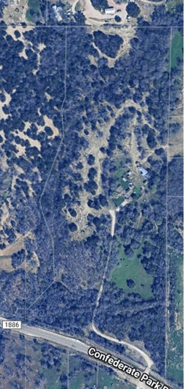 Per TAX the property is 18.42 Acres with 17.42 Acres currently in Agricultural Production and almost 750 foot of road frontage on Hwy 1886 - Confederate Park Rd. The property has been Professionally Appraised at the Original Listing Price. The value is in the land though the property has a working well and septic system. The house was being lived in, could be lived in, as the Air Conditioning and plumbing are functioning. BE AWARE OF THE DEED RESTRICTIONS THAT PROHIBIT MOBILE OR MANUFACTURED HOMES AND PROHIBITS THE PROPERTY FROM BEING USED AS A RV PARK.