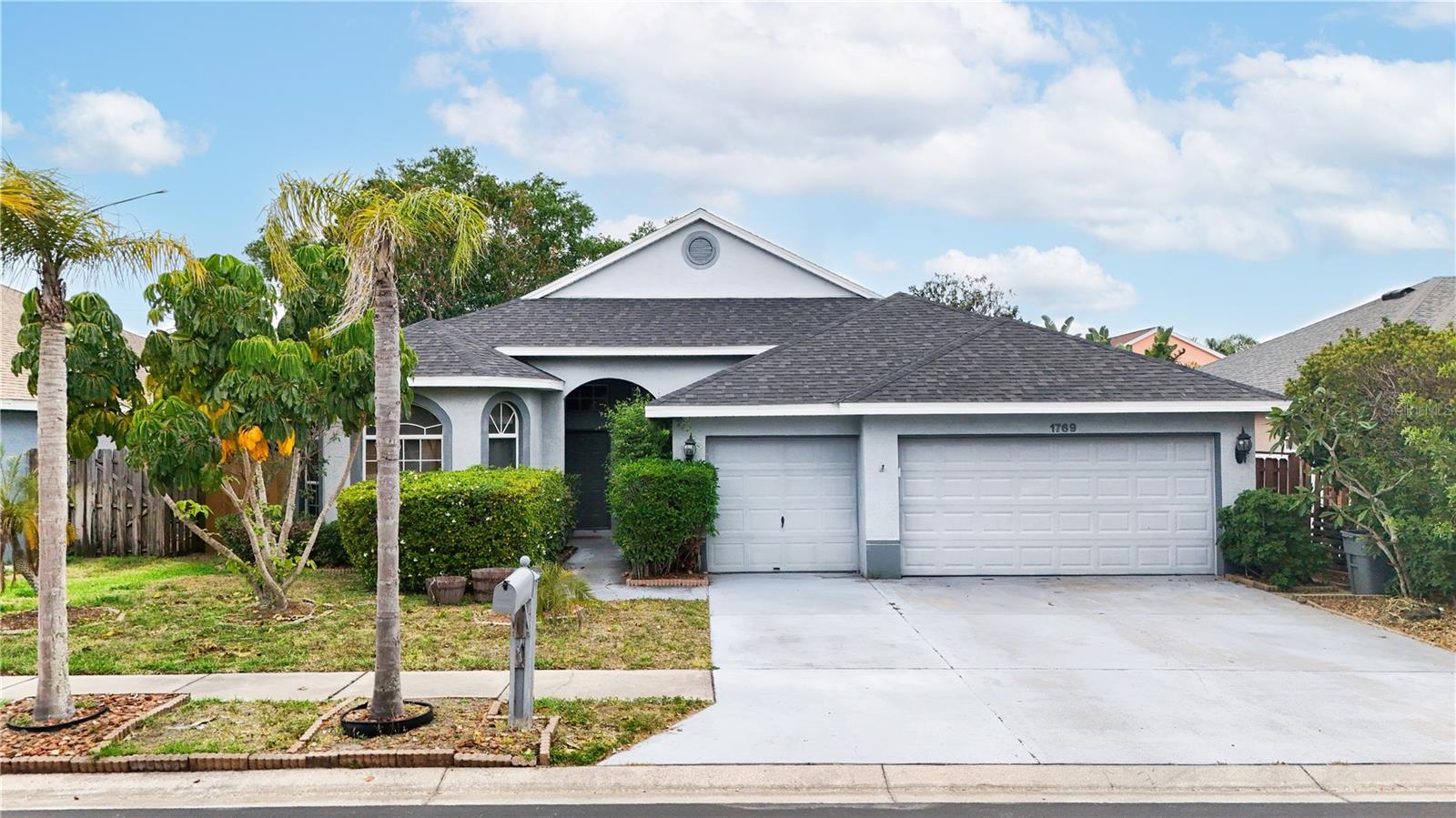 Located in the highly desirable gated community of Forest Ridge in Tarpon Springs, this spacious 4-bedroom, 2-bathroom single-family home offers over 2,000 square feet of well-designed living space and a rare 3-car garage. Vaulted ceilings throughout create an open and airy feel, complemented by a combination of travertine and laminate flooring. The primary suite features a walk-in closet and a generously sized en-suite bathroom with dual sinks, a soaking tub, and a walk-in shower. The home’s functional layout includes direct access from the 3-car garage into the laundry room and then into the main living area. Step outside to a beautifully fenced backyard with a pavered patio, perfect for entertaining or relaxing. With a roof replaced in 2022 and a non-flood zone location, this property offers added peace of mind. Centrally located near parks, Gulf beaches, shopping, dining, entertainment, and vibrant downtown Tampa, this is an excellent opportunity for homeowners and investors alike—schedule your private showing today.