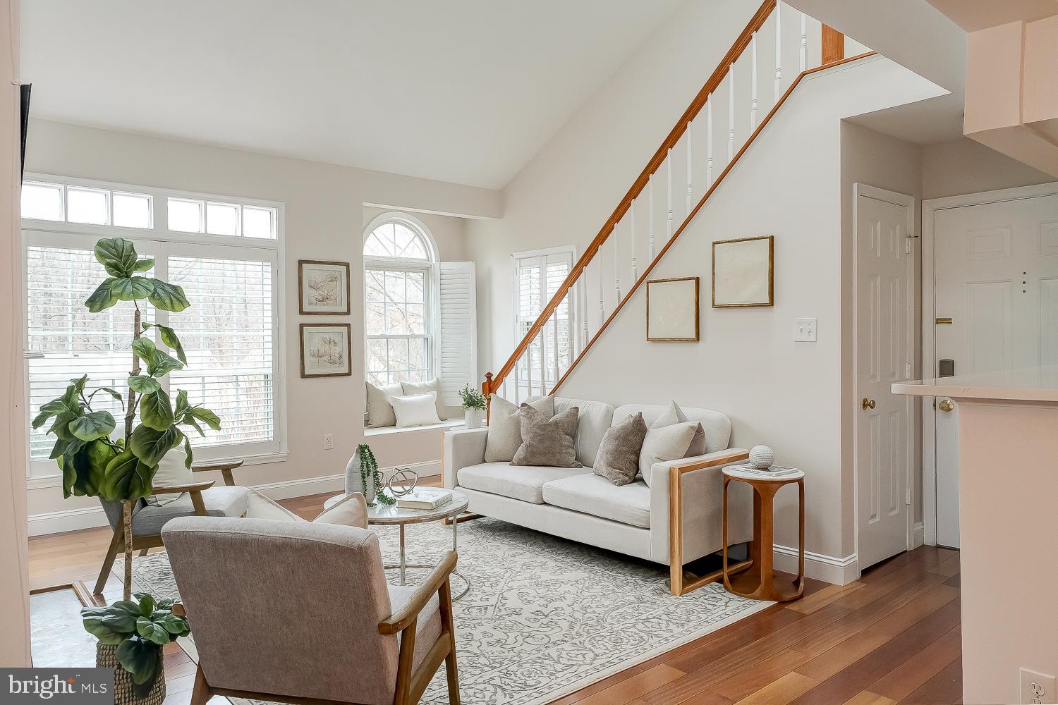 Charming two-bedroom with spacious loft with modern upgrades and outdoor living!This beautifully appointed garden-style condo offering 1,110 square feet of comfortable and contemporary living was thoughtfully designed as it boasts two spacious bedrooms, one beautifully renovated bathroom, with an extra vanity area and a versatile mix of hardwood and new carpet flooring to suit your lifestyle.Step inside to an inviting living space that features a cozy fireplace, perfect for relaxing or entertaining guests. The updated bathroom adds a touch of modern elegance, while the in-unit washer and dryer enhance everyday convenience. Stay cool with air conditioning, and enjoy access to your own private balcony, ideal for sipping morning coffee or unwinding after a long day.Assigned parking and abundant guest parking make life easy, while an array of community amenities elevate your living experience. Stay active with access to a basketball court, tennis court, and great trails! Other fantastic nearby amenities include:• Pools managed by the association (community outdoor pools in summer)• Lakes and waterfront recreation• Extensive walking and biking trails through wooded areas and around the lakes• Parks and green spaces just outside your door• More tennis courts and sports fields Quiet, wooded setting located in the vibrant Reston area, this move-in-ready condo offers all the essentials for comfort and enjoyment.  Easy access to great restaurants, shops, and all the major arteries of travel. Make this incredible property your new home!