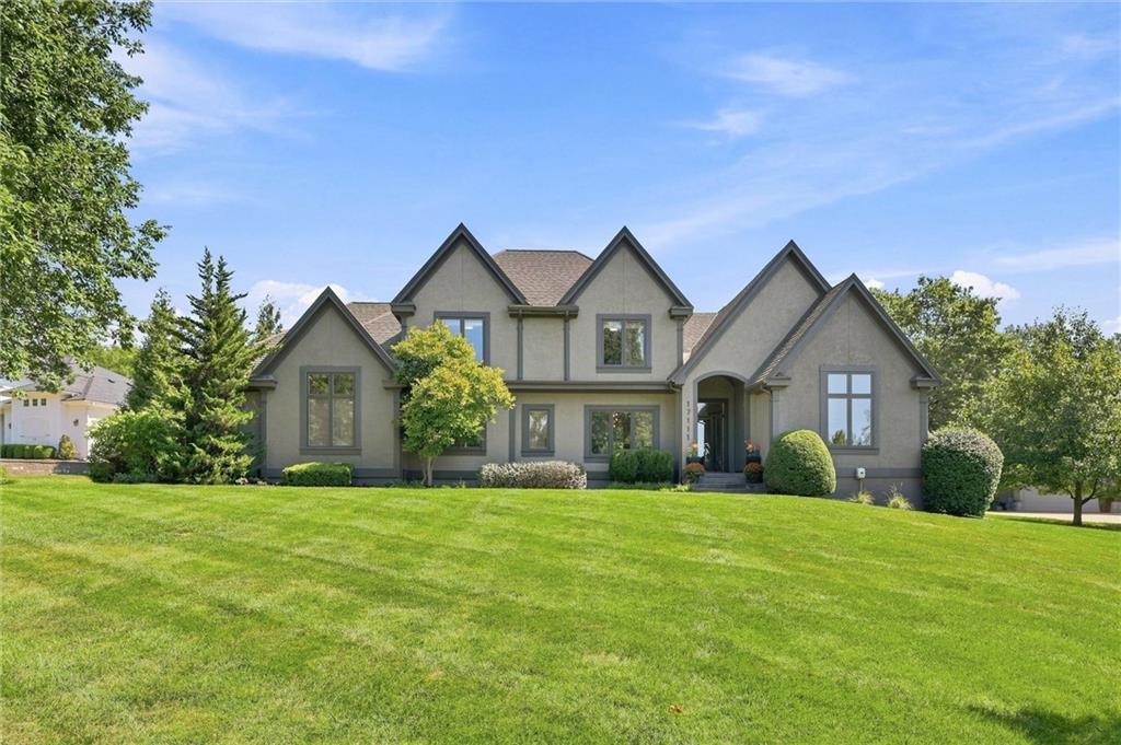 LUXE in Loch Lloyd. REMODELED + UPGRADED: BRAND NEW KITCHEN, HARDWOODS THROUGHOUT, REPOSITIONED STAIRCASE = REIMAGINED FLOORPLAN, INSTALLED ADDITIONAL WINDOWS, CUSTOM CARPENTRY: BASEBOARDS, WINDOW & DOOR TRIM, REDESIGNED FIREPLACE IN HEART OF HOME, LIGHTING, FRESH EXTERIOR & INTERIOR PAINT, NEWer HVAC, REDESIGNED SCREENED PORCH, FRONT DOOR & EXPANSIVE DECK. Expansive lower level with endless possibilities (Speakeasy anyone?!).  Beautifully positioned for privacy on near acre lot loaded with abundance of mature trees. Unparalleled Tranquility + Elevated Lifestyle within KC's favorite neighborhood.