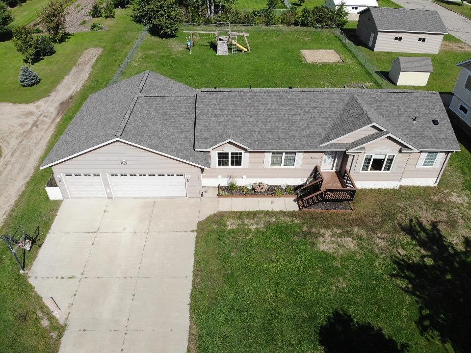 BACK ON THE MARKET WITH A NEW ROOF!! There is room for everyone and everything in this impressive 5-bedroom, 3-bath home offering over 3,000 square feet of comfortable living space! The spacious floor plan features a private primary suite, main floor laundry, kitchen island, generous living areas along with three main floor bedrooms and two more in basement. The lower-level family room is the perfect gathering place, complete with a large entertainment area and wet bar, making it ideal for hosting game days, holidays, and special occasions.Car enthusiasts, hobbyists, and outdoor lovers will appreciate the heated 3-stall attached garage along with the 28x32 insulated detached garage, providing exceptional space for vehicles, boats, recreational toys, storage, or a workshop.With abundant living space, desirable amenities, and endless possibilities both inside and out, this property is ready to accommodate your lifestyle. Schedule your showing today and discover all this exceptional home has to offer!