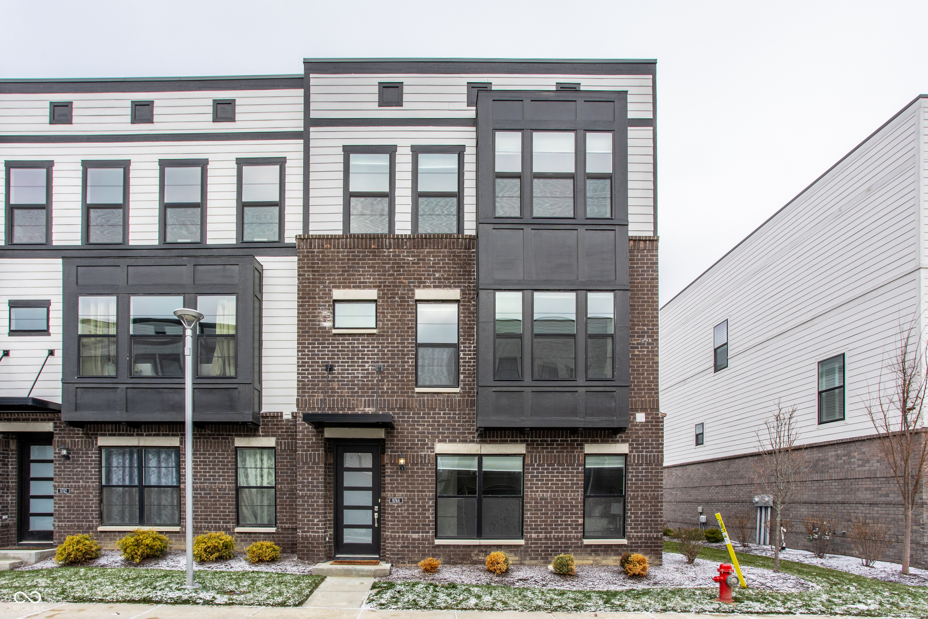 Beautiful updated end unit townhome with all top-notch modern features. Stylish living right next to the vibrancy of the Fishers District. Rare 4-bedroom with extra living space on main floor. Exquisite kitchen design with huge island and high-quality appliances for your culinary pursuits or to entertain your guests. Very large balcony. Make good use of all the resort-styled amenities of the Clubhouse including pool and gym. Enjoy the convenience of a wide range of superior eateries just around the corner. Two-car garage. Close to I-69.