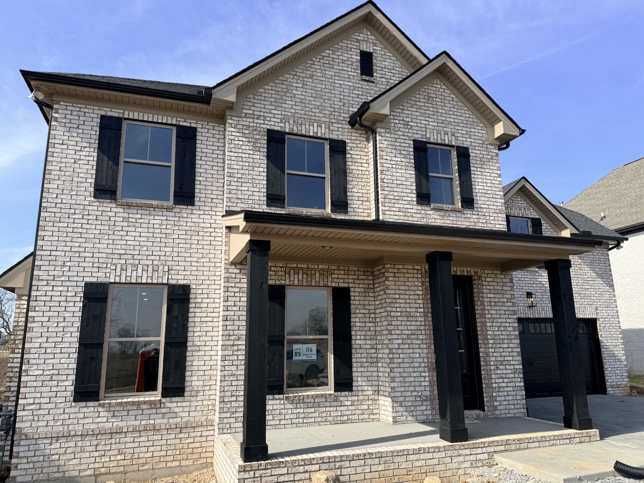 $11,500 in incentives on this home if you close by 3/31/26! Step into the Westfield community with this all-brick 3-bed, 2.5-bath, 2,220 sq ft new construction home. The inviting front-entry garage and thoughtful design set the tone for modern living. Inside, an open kitchen features quartz countertops, a designer tile backsplash, upgraded cabinetry, and stainless steel appliances, flowing seamlessly into a spacious living room with a gas fireplace. Durable plank flooring runs through the main living areas, while bedrooms and the large upstairs rec space offer comfort with plush carpet, and tile accents the baths. The primary suite impresses with a tiled shower and dual vanities. Two additional bedrooms upstairs, plus two full baths, create versatile living options. Neutral paint, upgraded stair finishes, and designer details complete the home. Westfield offers a community pool and is conveniently located near Station Camp schools, shopping, and major commuter routes.