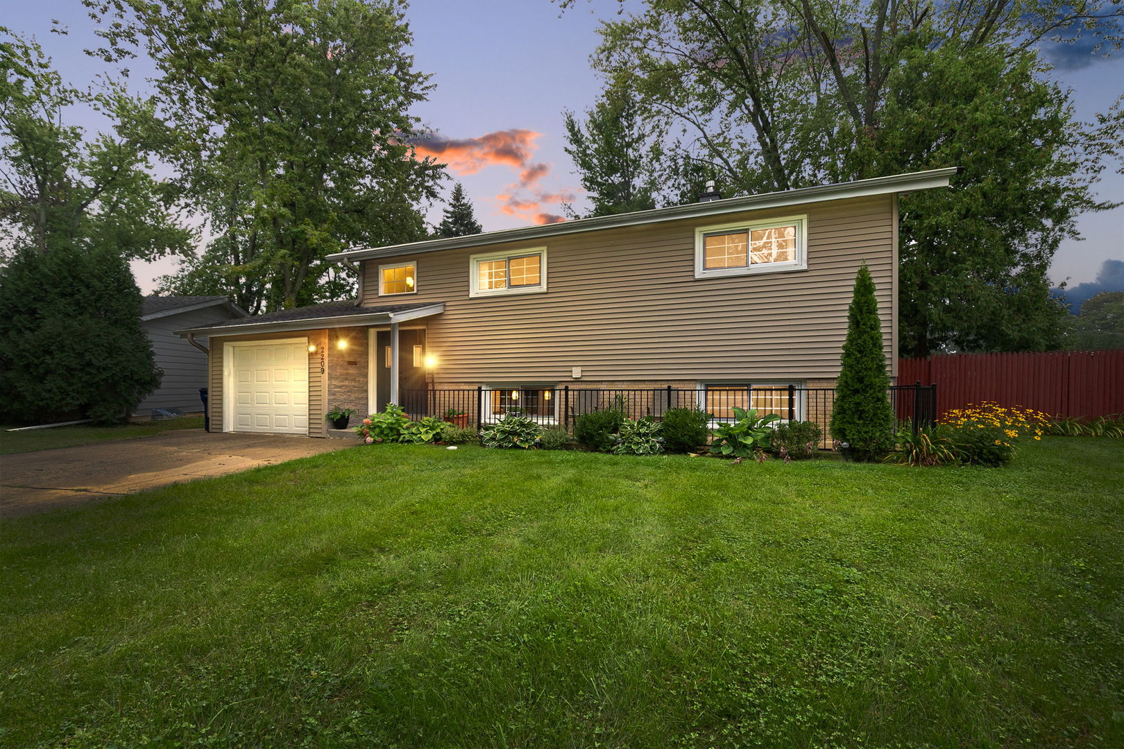 Impeccable updated northside gem! Open floor plan with family room featuring cozy fireplace and sliding door to fenced in yard w/ oversized deck, covered porch, custom wood bench and large fire pit- perfect for entertaining. Bright & spacious updated kitchen with SS appliances, quartz countertops and oversized island. Remodeled bath with whirlpool tub, 4th bedroom and laundry complete the lower level.The main level featuring gleaming hardwood floors flowing thoroughout sun filled living room & three good sized bedrooms & updated hall bath. Beautiful custom woodwork w/ crown and window molding - every detail meticulously done for you. This is a must see!!