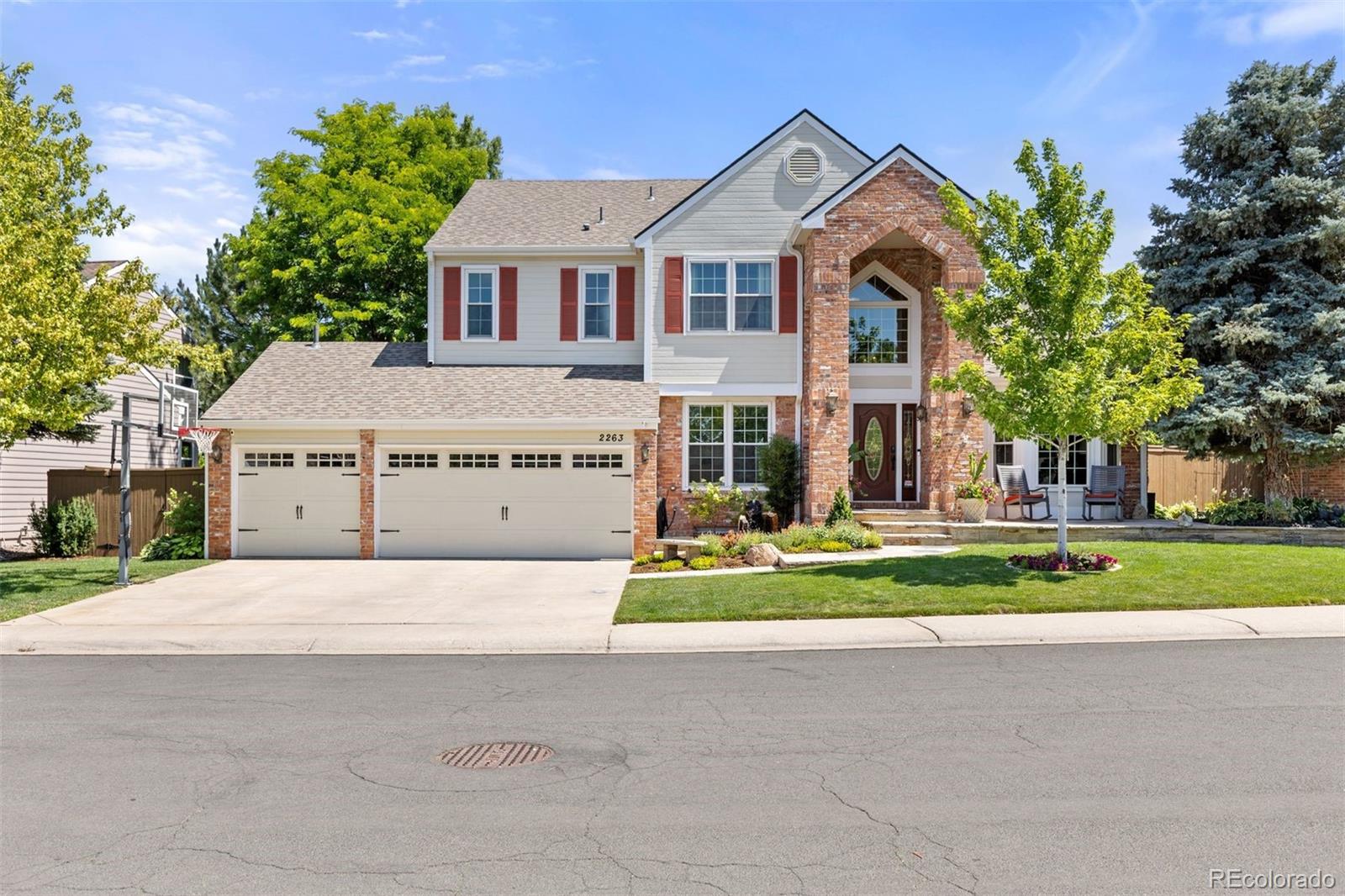 Welcome to this exceptional Highlands Ranch residence, where timeless elegance meets everyday comfort. Offering 6 bedrooms, 5 bathrooms, and nearly 5,000 square feet of beautifully designed living space, this home is perfectly positioned on a quiet street overlooking a cul-de-sac with meticulously maintained landscaping.The open-concept floor plan is designed for both effortless entertaining and comfortable daily living, centered around a beautifully updated kitchen featuring new cabinetry, a gas range, generous prep space, a gathering island, and seamless flow into the main living areas. A dedicated main floor office provides the ideal work from home retreat, while the spacious laundry room and mudroom offer exceptional functionality. Upstairs, you’ll find four generously sized bedrooms, including a luxurious primary suite with a fully remodeled 2026 spa-inspired bathroom and a bonus nook with bay windows overlooking the backyard. The finished lower level expands the home’s versatility with two additional bedrooms, a large recreation and entertainment area, a bonus room, and a wet bar, perfect for hosting game nights, movie marathons, or extended guest stays. Step outside to your own private backyard oasis. Thoughtfully designed for year-round enjoyment, the outdoor living space features a fully equipped outdoor kitchen, a wood fired pizza oven, a fire pit with built in seating, an expansive stamped concrete patio, lush lawn, dedicated turf play area, and impeccably maintained landscaping that creates both beauty and privacy. Close to Westridge Rec Center, grocery stores, coffee shops, and open spaces for walking trails and parks, this remarkable home offers the perfect blend of luxury, functionality, and exceptional indoor-outdoor living while being located in one of Highlands Ranch’s most sought after neighborhoods. This stunning move in ready home is being sold fully furnished, featuring designer furniture, curated art, and decor for a stress free transition.