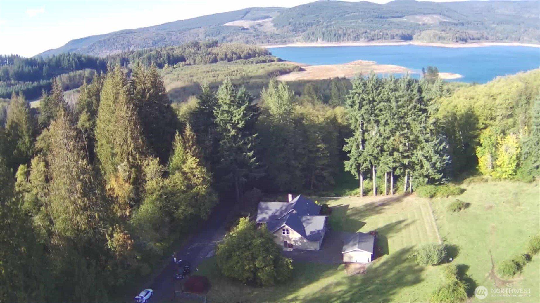 Do you crave a peaceful place or a wonderful location? This property is a piece of paradise—walking distance to Riffe Lake and Swofford Pond. Built in 1932, this charming home has undergone a complete restoration. There is a gigantic producing walnut tree and an apple tree. Wildlife is abundant at the property, including deer, elk, bear, and squirrels. The chanterelle mushroom hiking trails are across the way. Special features of the home include a Quartz countertop, fir wood floors throughout, two heat pumps, a spacious laundry room, all appliances included, a cast-iron working stove, a dog wash station, wired for a generator, three bedrooms, three bathrooms, and a marble shower in the primary bathroom. This home is a Lovely home.