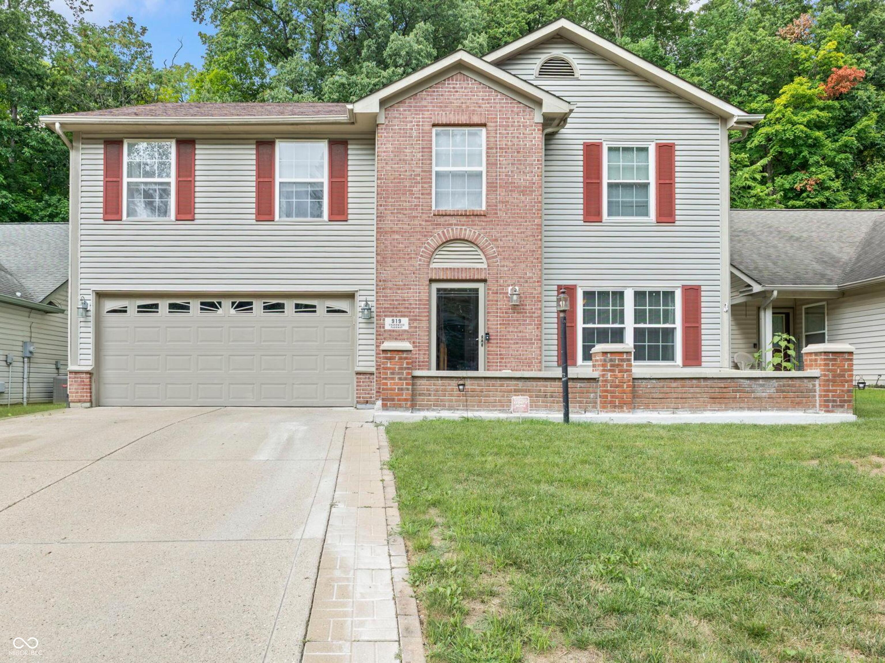 Where comfort meets convenience-this 4-bedroom, 2.5-bath Beech Grove beauty is ready to welcome you home. Perfectly positioned with direct access to the scenic Franciscan Trail, you'll enjoy over two miles of paved walking and biking paths winding through the heart of Beech Grove, connecting you to Sarah T. Bolton Park with its playgrounds and basketball courts, and ending near the Don Challis Park with sand volleyball and baseball fields. This isn't just a house-it's a gateway to an active, connected lifestyle. Step onto the charming courtyard-style front porch and into a warm foyer that sets the tone. A flexible front living room offers endless possibilities-a home office, playroom, or second living area. The back of the home opens up into an inviting family room anchored by a floor-to-ceiling brick electric fireplace, perfect for cozy nights in. The open flow continues into the breakfast room, with doors leading to your fully fenced backyard featuring an open patio and peaceful treeline views. The kitchen is both functional and stylish, offering a breakfast bar, pantry, stainless steel appliances, and generous cabinet space-perfect for both quick weekday dinners and weekend entertaining. Upstairs, the primary suite is a private retreat, with vaulted ceilings, his-and-her walk-in closets, dual sinks, a soaking tub, and a separate shower. The other three bedrooms are impressively spacious-each with its own walk-in closet-and share a hall bath with a tub/shower combo. With its prime location, thoughtful layout, and room for everyone, this home checks all the boxes. Opportunities to live in this kind of community setting-right on the trail-don't come often. Schedule your showing today and see why this home should be yours before someone else claims it!